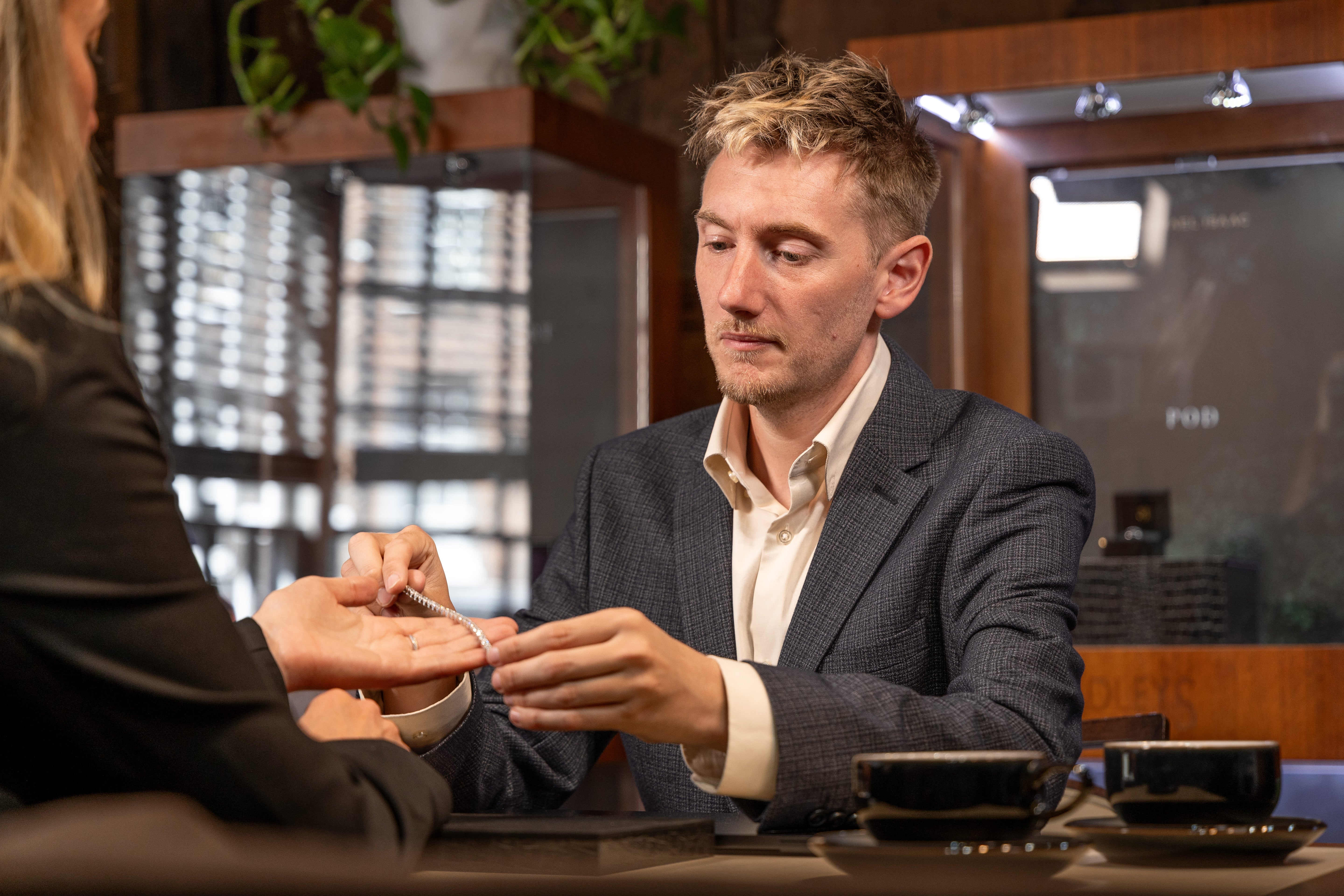 Client viewing custom-made jewellery at Michael Isaac York showroom