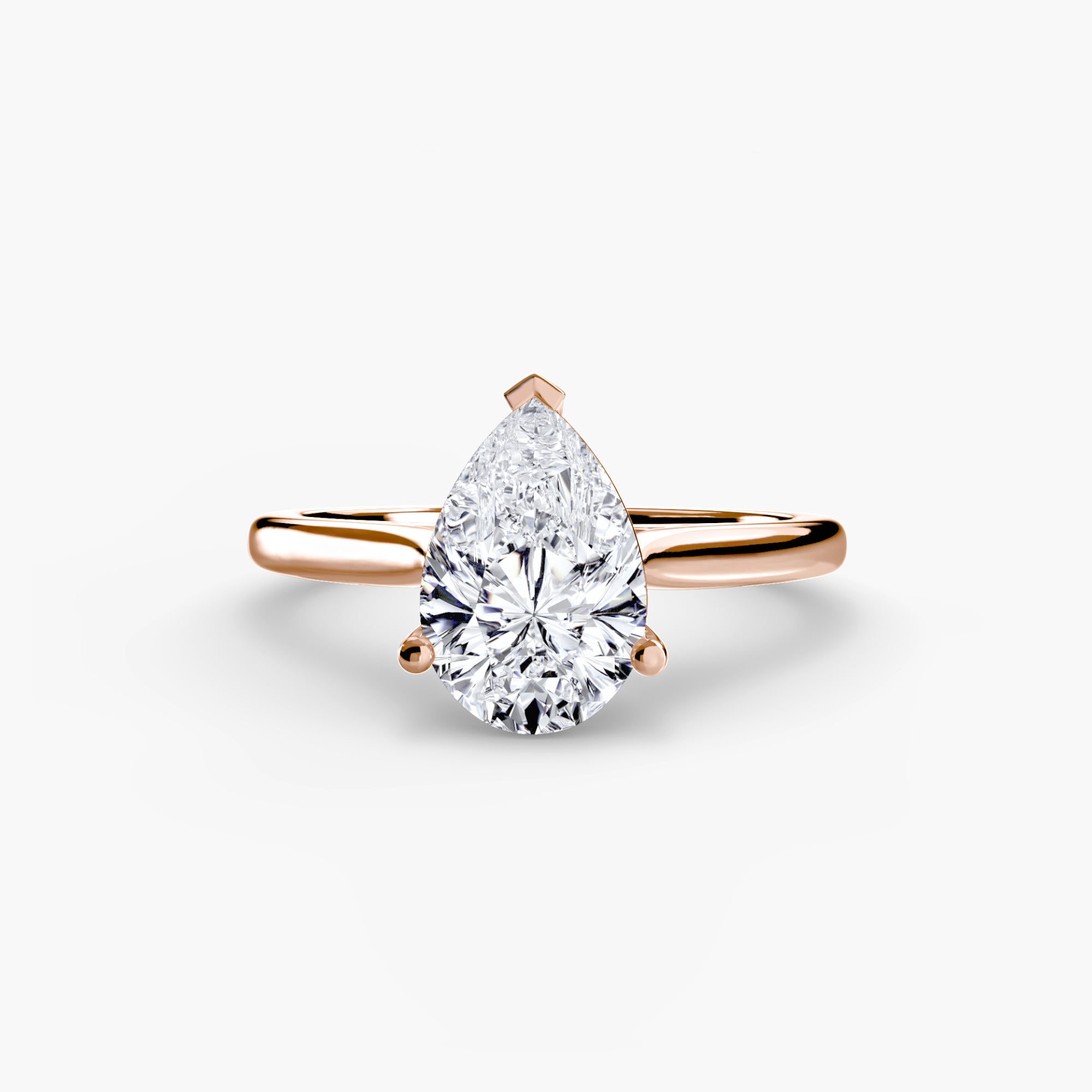 The MICHAEL ISAAC Solitaire ring 1 is a gold minimalist ring with a large pear-shaped diamond solitaire in a classic setting, shown against a plain white background.