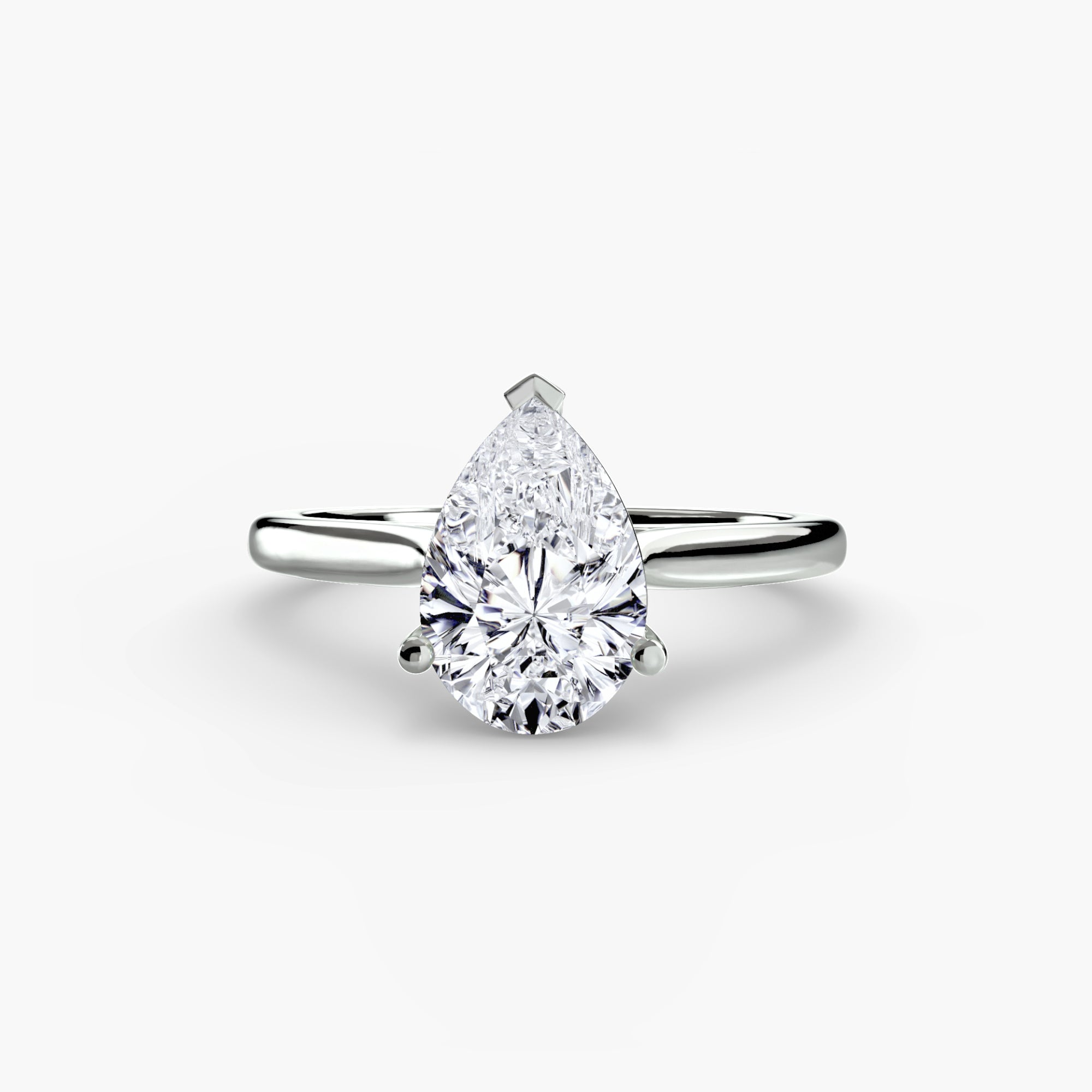 The Solitaire ring 1 by MICHAEL ISAAC is a minimalist silver piece featuring a large pear-shaped diamond solitaire in a classic prong setting, showcased on a plain white background.
