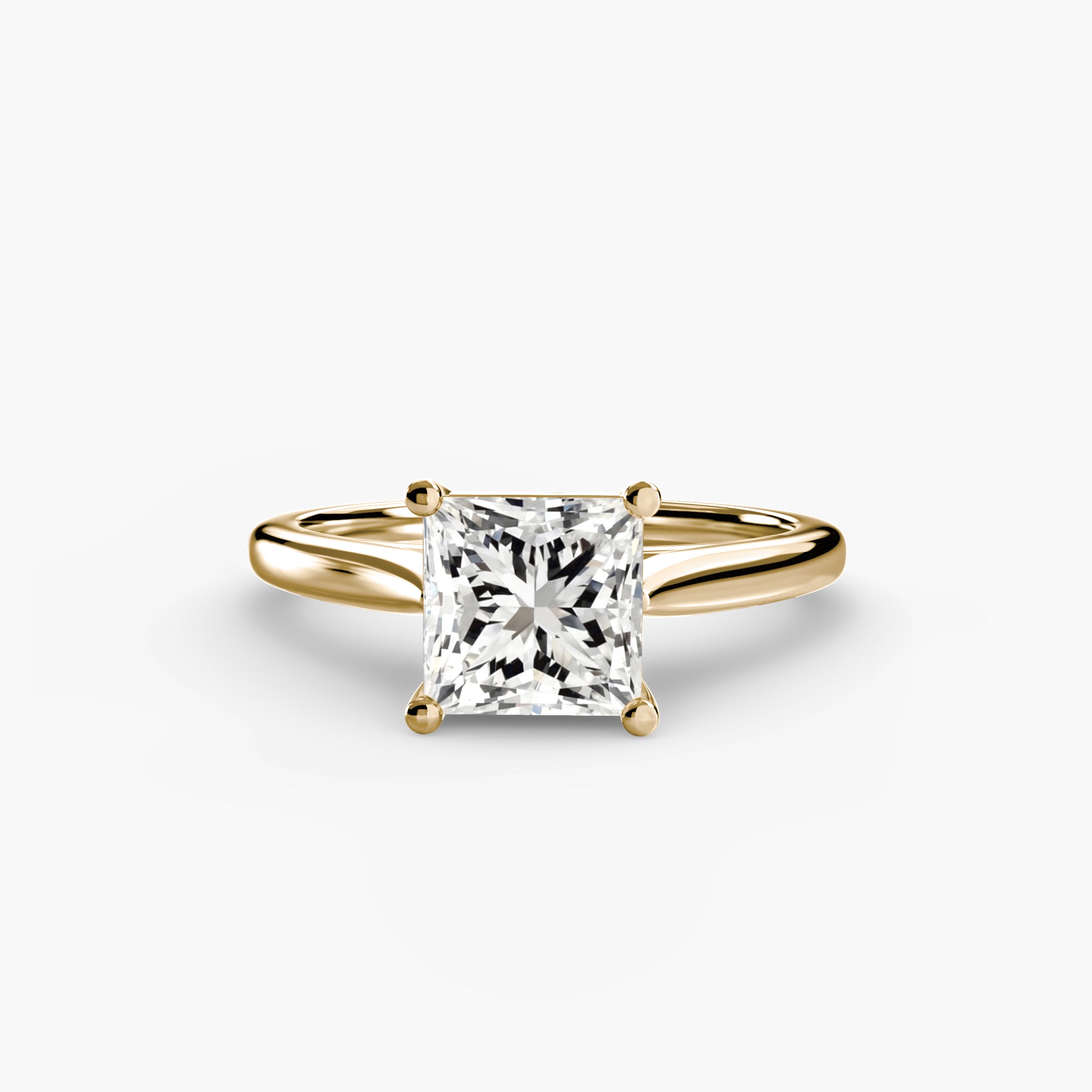 The MICHAEL ISAAC Solitaire ring 1 features a gold band with a square, princess-cut diamond in a classic four-prong setting, shown on a plain white background.