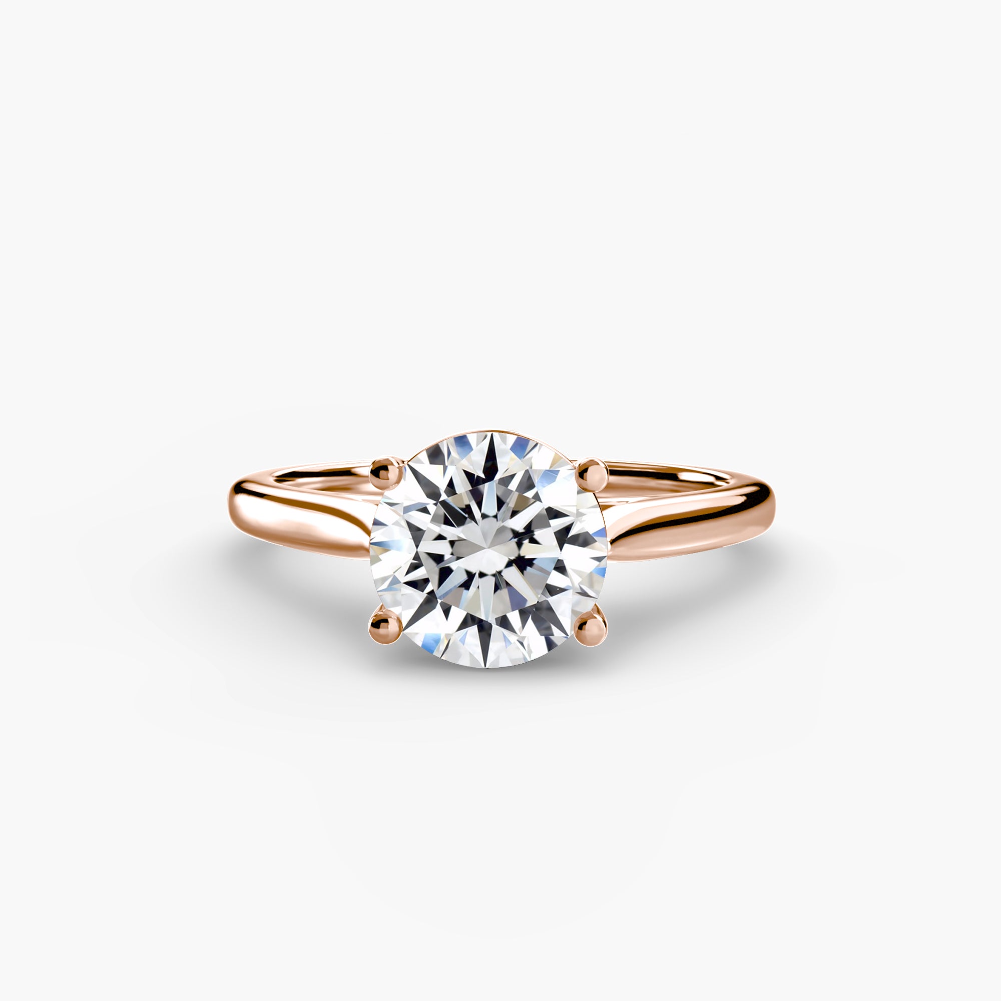 The MICHAEL ISAAC Solitaire ring 1 is a rose gold minimalist piece with a thin band and a large round brilliant-cut diamond in a classic four-prong setting, shown on a plain white background.