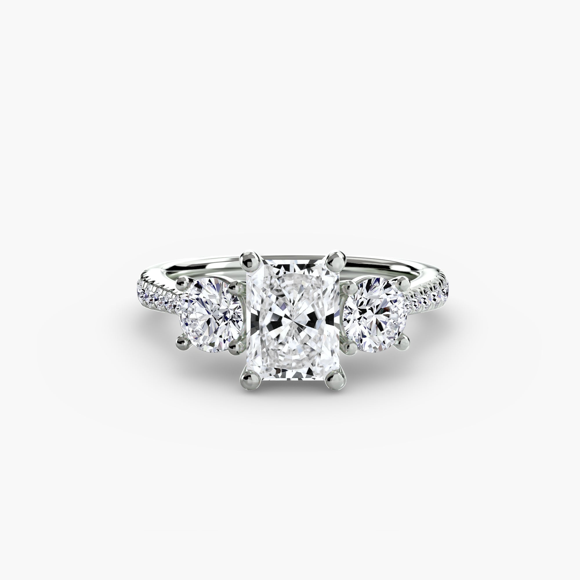 The MICHAEL ISAAC Three-Stone with Pavé Band ring showcases a large rectangular center diamond flanked by two round side diamonds on a pavé band, displayed on a plain white background.