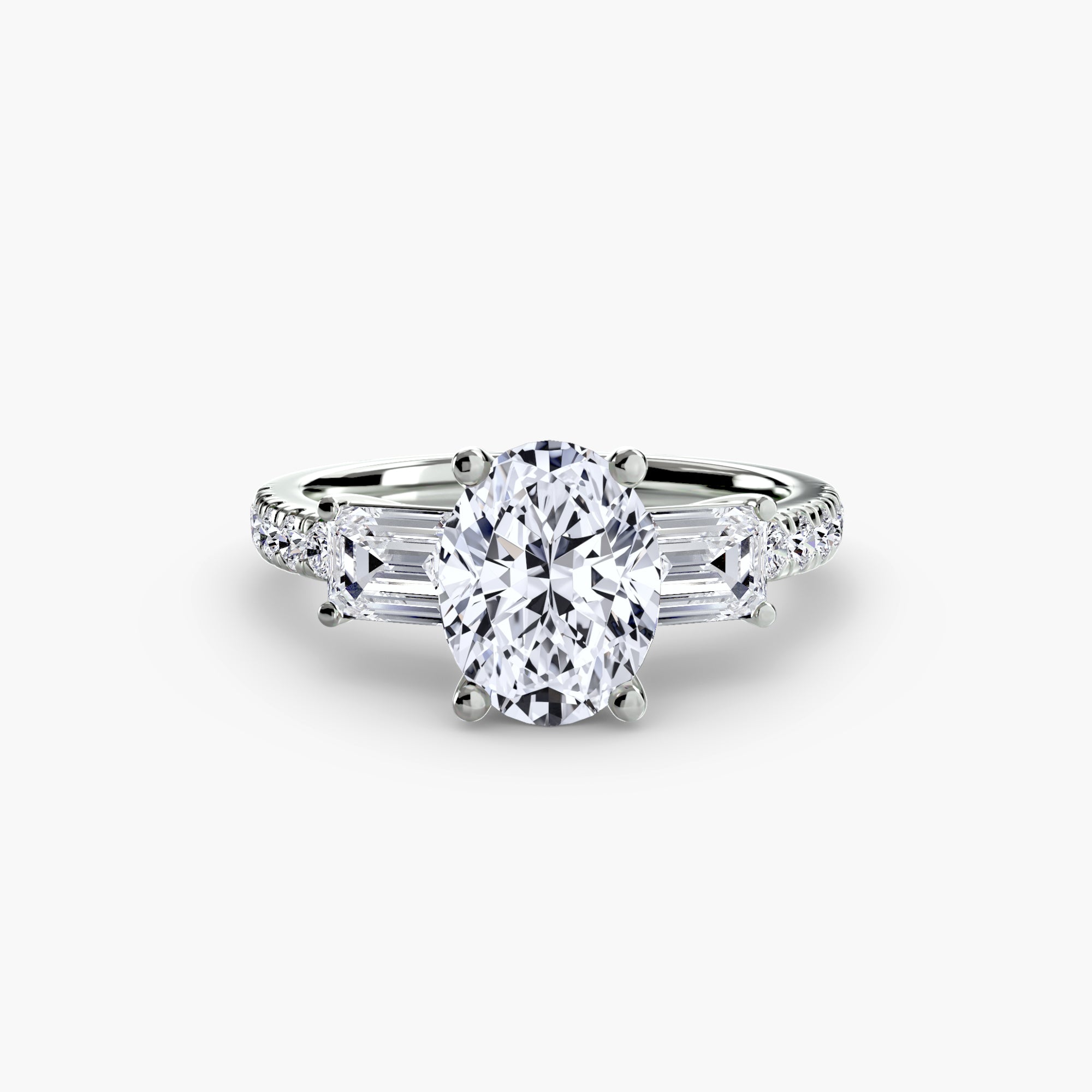 The MICHAEL ISAAC Three-Stone Ring with Pavé Band 4 features an oval-cut diamond center, tapered baguette accents, and pavé-set round diamonds on a platinum band, showcased against a white background.