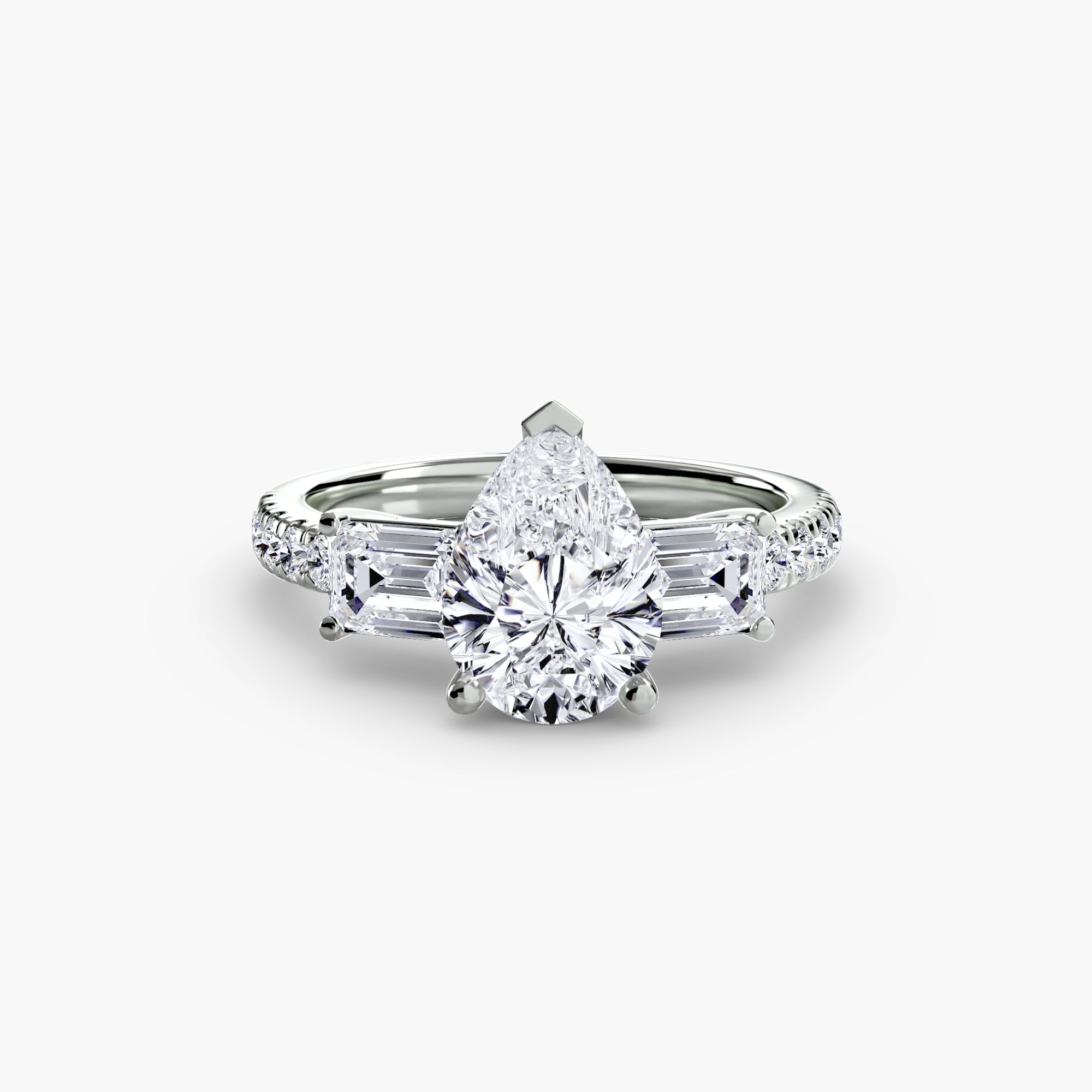 The MICHAEL ISAAC Three-Stone Ring with Pavé Band 4 features a pear-shaped center diamond flanked by two trapezoid diamonds, set on a silver pavé band accented with small diamonds. Displayed against a plain white background.