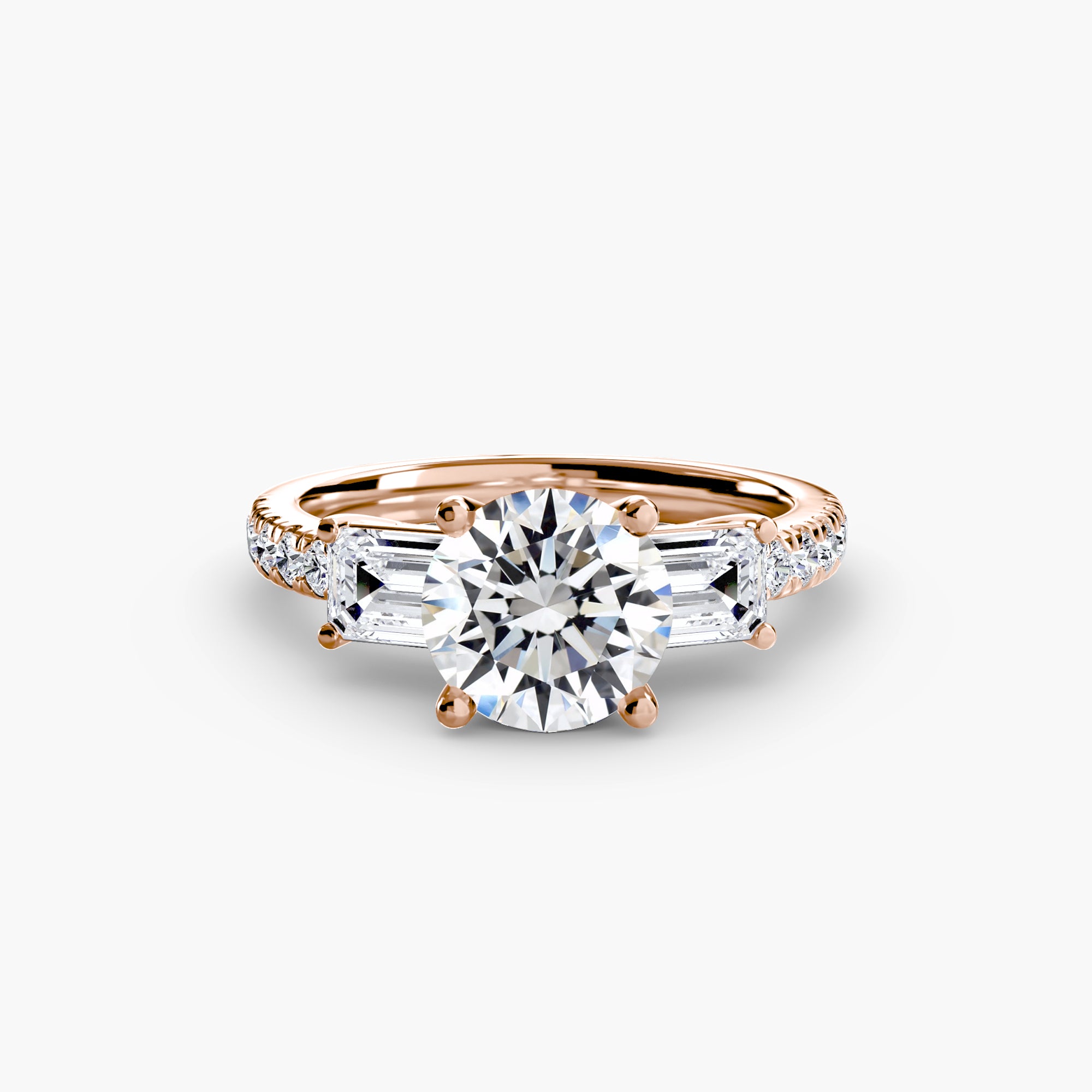 The MICHAEL ISAAC Three-Stone Ring with Pavé Band 4 features a large round center diamond, two baguette-cut side diamonds, and a rose gold pavé band adorned with smaller round diamonds.