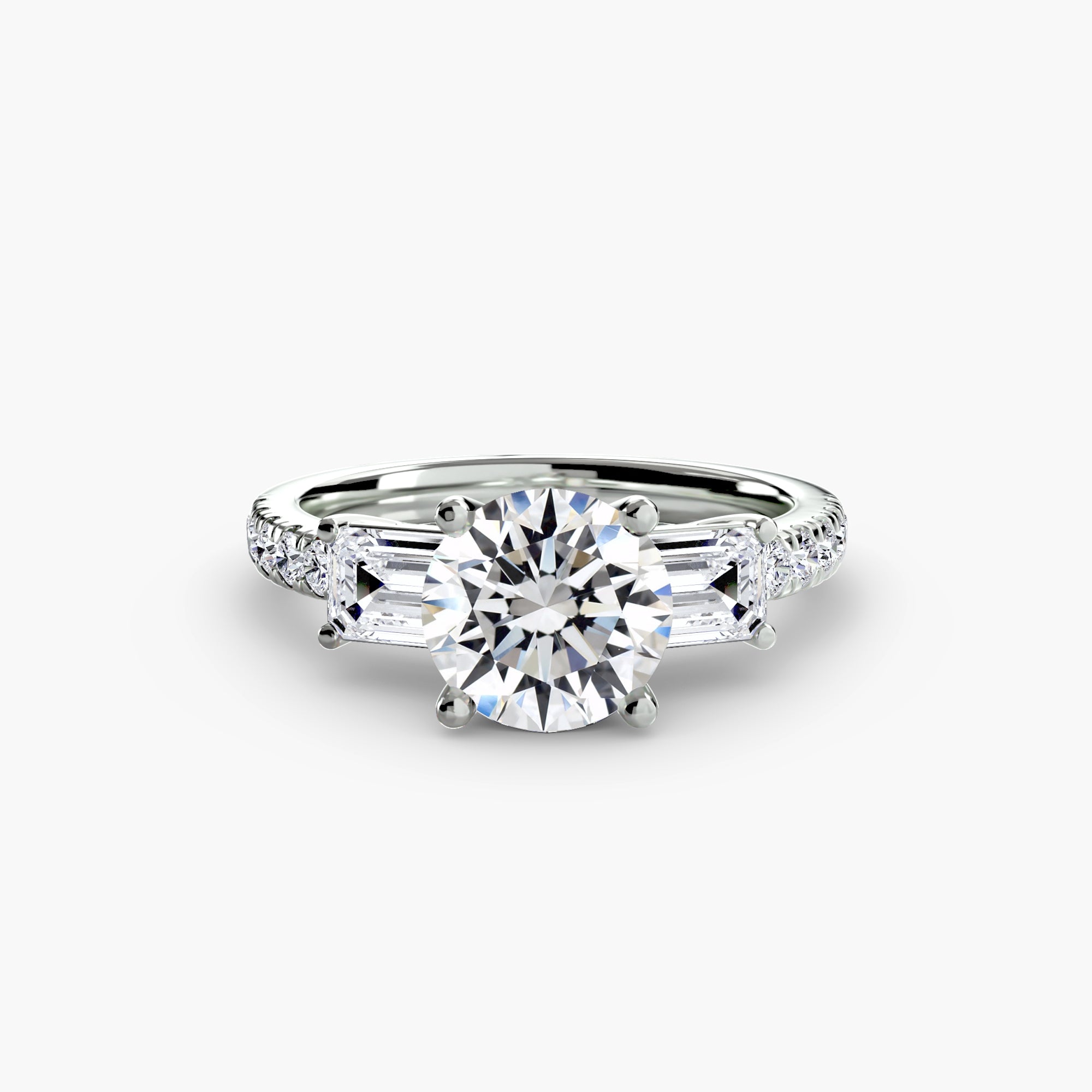 The MICHAEL ISAAC Three-Stone Ring with Pavé Band 4 features a platinum band with a round center diamond, baguette side diamonds, and shimmering pavé-set accents for an elegant look.