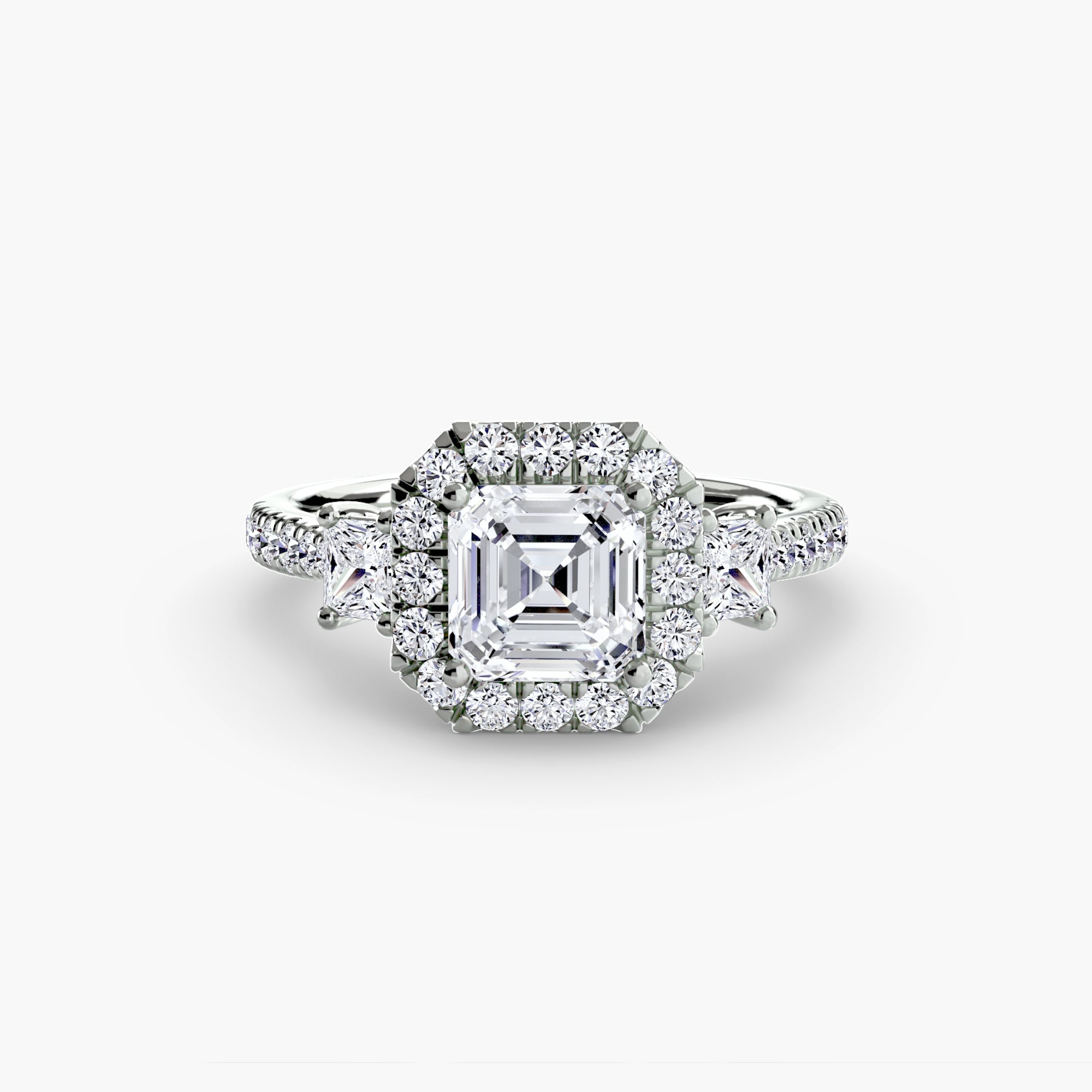 The MICHAEL ISAAC Three-Stone Ring with Halo 2 showcases an asscher-cut center diamond, haloed by round diamonds and accented with additional diamonds along the white gold band for a modern look.