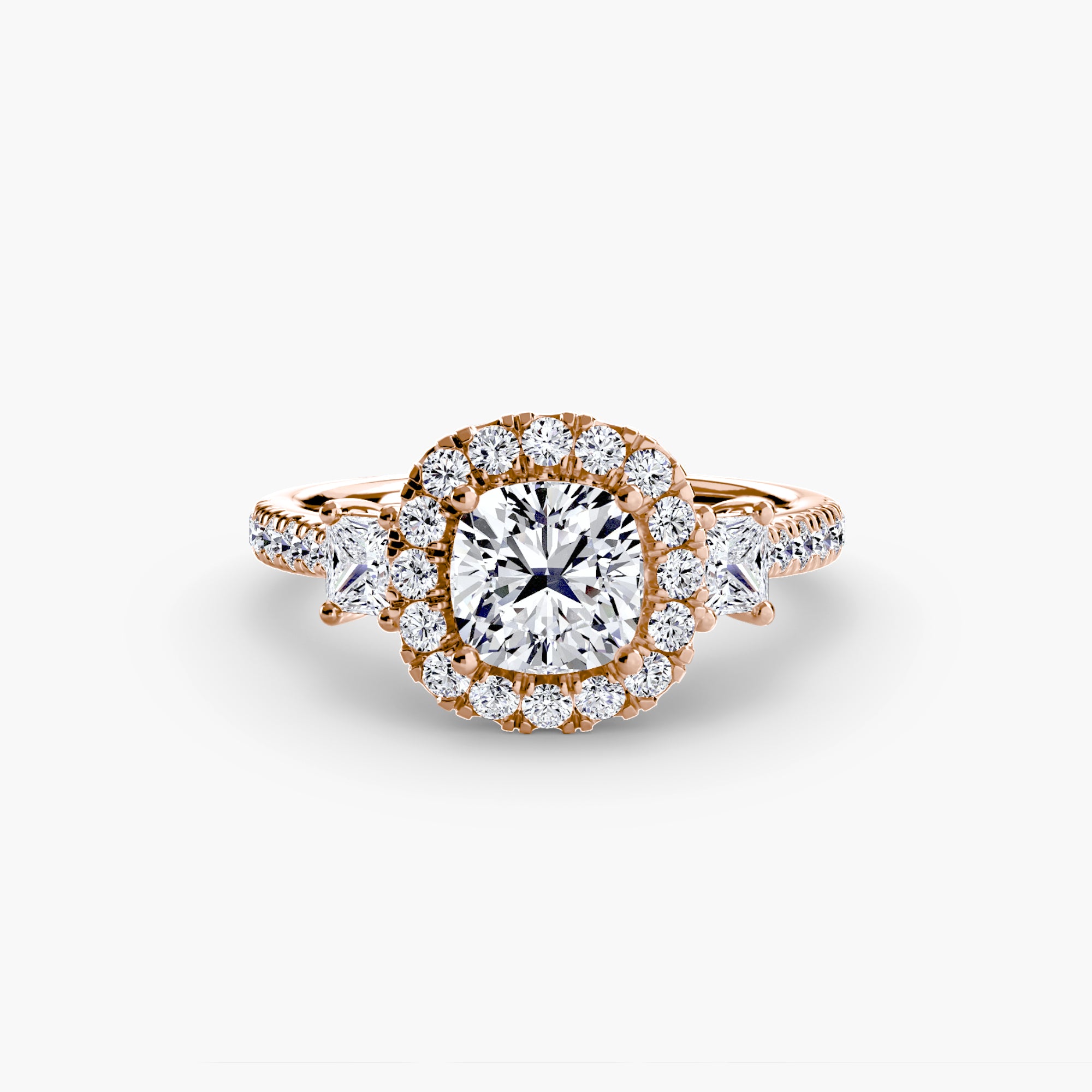 The MICHAEL ISAAC Three-Stone Ring with Halo 2 features a rose gold band, round center diamond, sparkling halo and side stones, displayed on a plain white background.