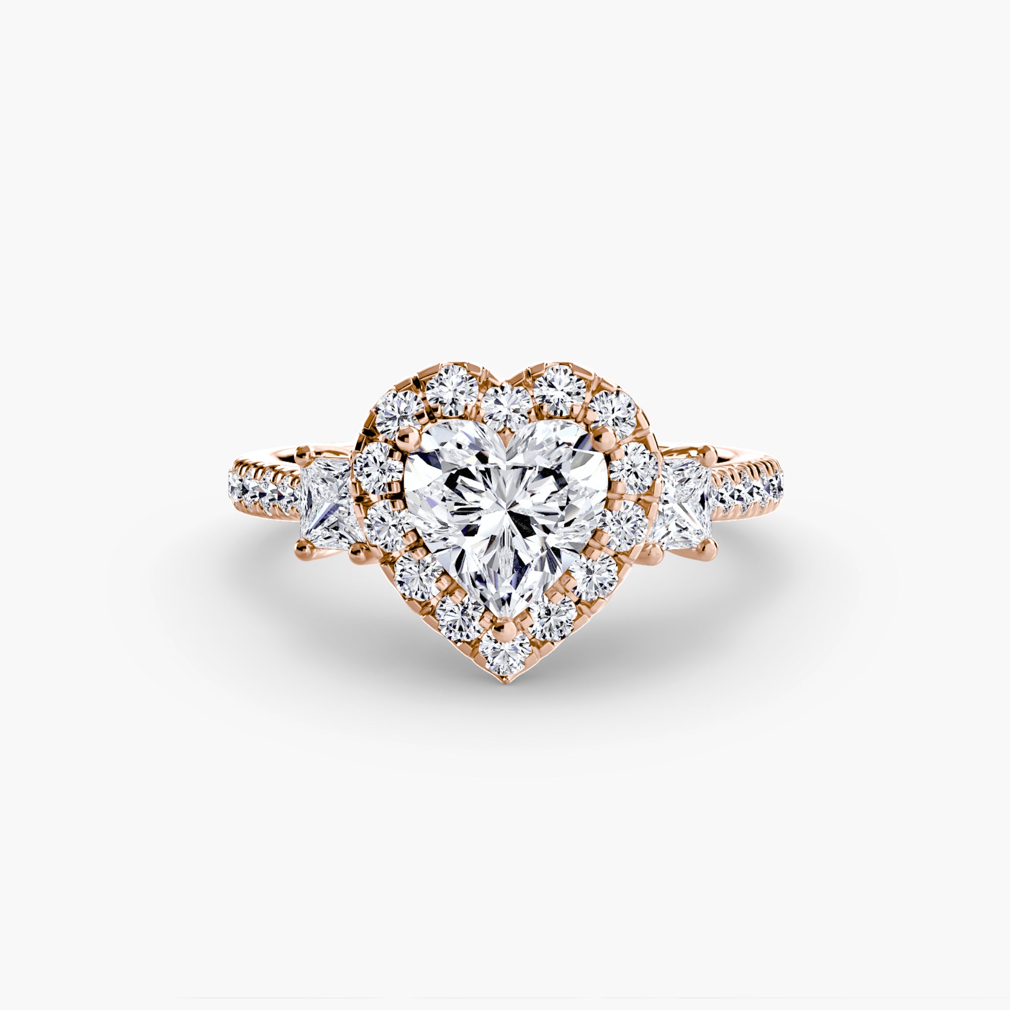 The MICHAEL ISAAC Three-Stone Ring with Halo 2 features a gold band set with a large heart-shaped diamond centerpiece, surrounded by a radiant halo and additional diamonds along the band.