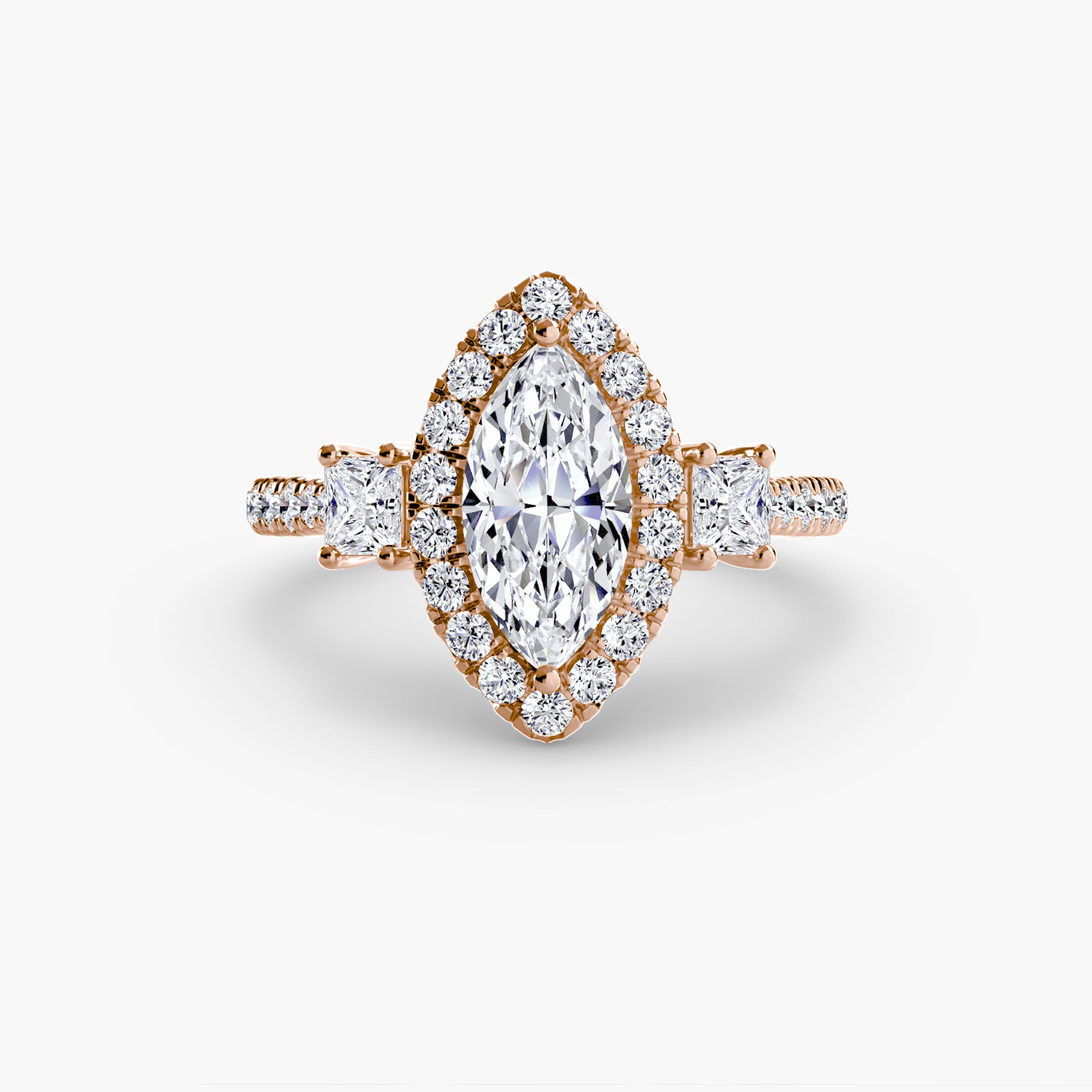 The MICHAEL ISAAC Three-Stone Ring with Halo 2 features a marquise-cut diamond center, radiant halo, and additional diamonds on a rose gold band adorned along the shoulders and sides.
