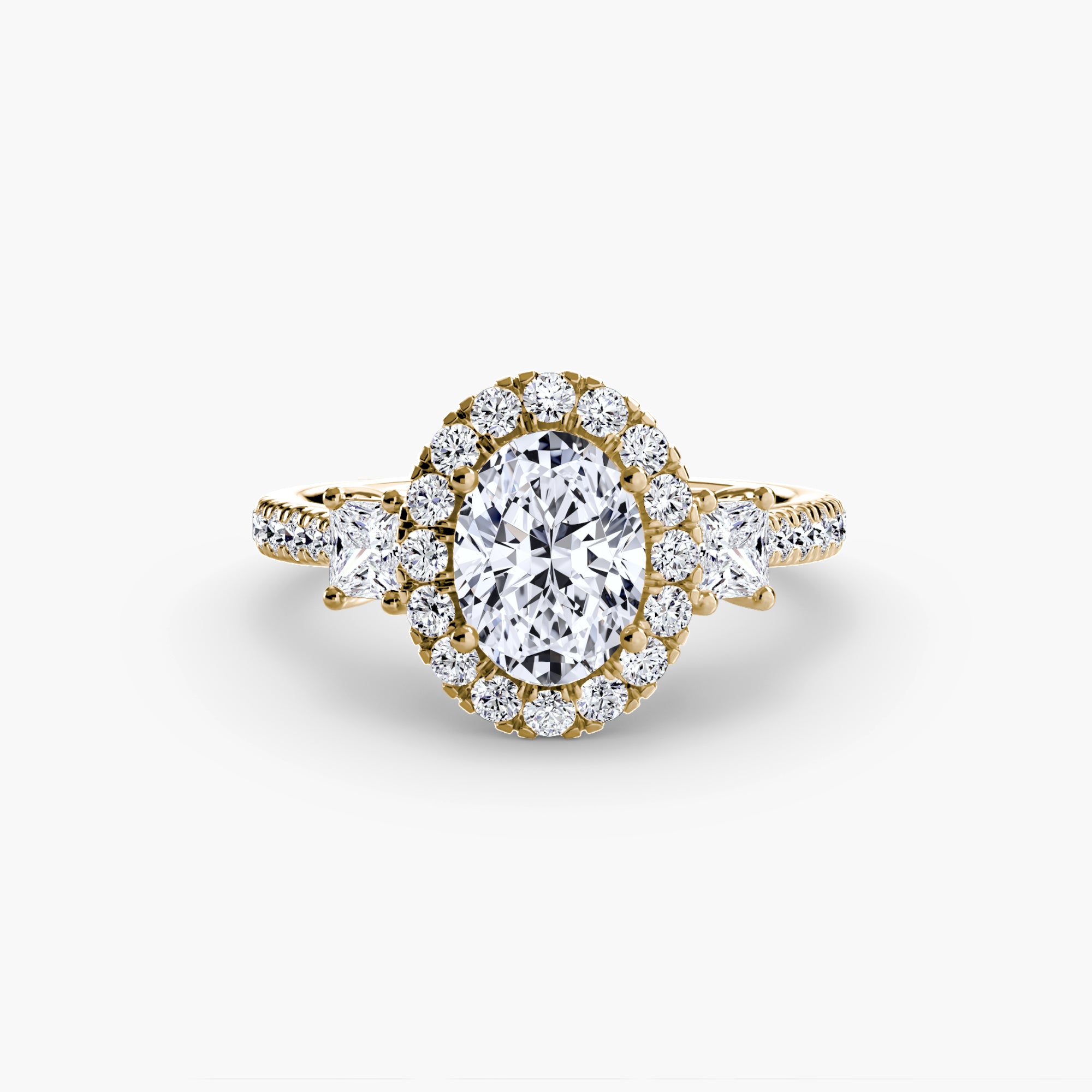 The MICHAEL ISAAC Three-Stone Ring with Halo 2 features an oval center diamond, a radiant halo, two larger side diamonds, and a diamond-accented band for a modern yet classic elegance.