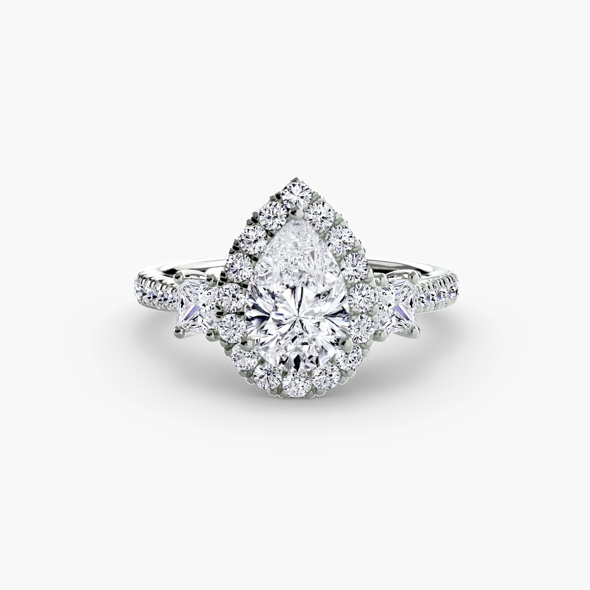 The MICHAEL ISAAC Three-Stone Ring with Halo 2 features a pear-shaped diamond center, radiant halo, and extra diamonds set along a silver band for a modern look.