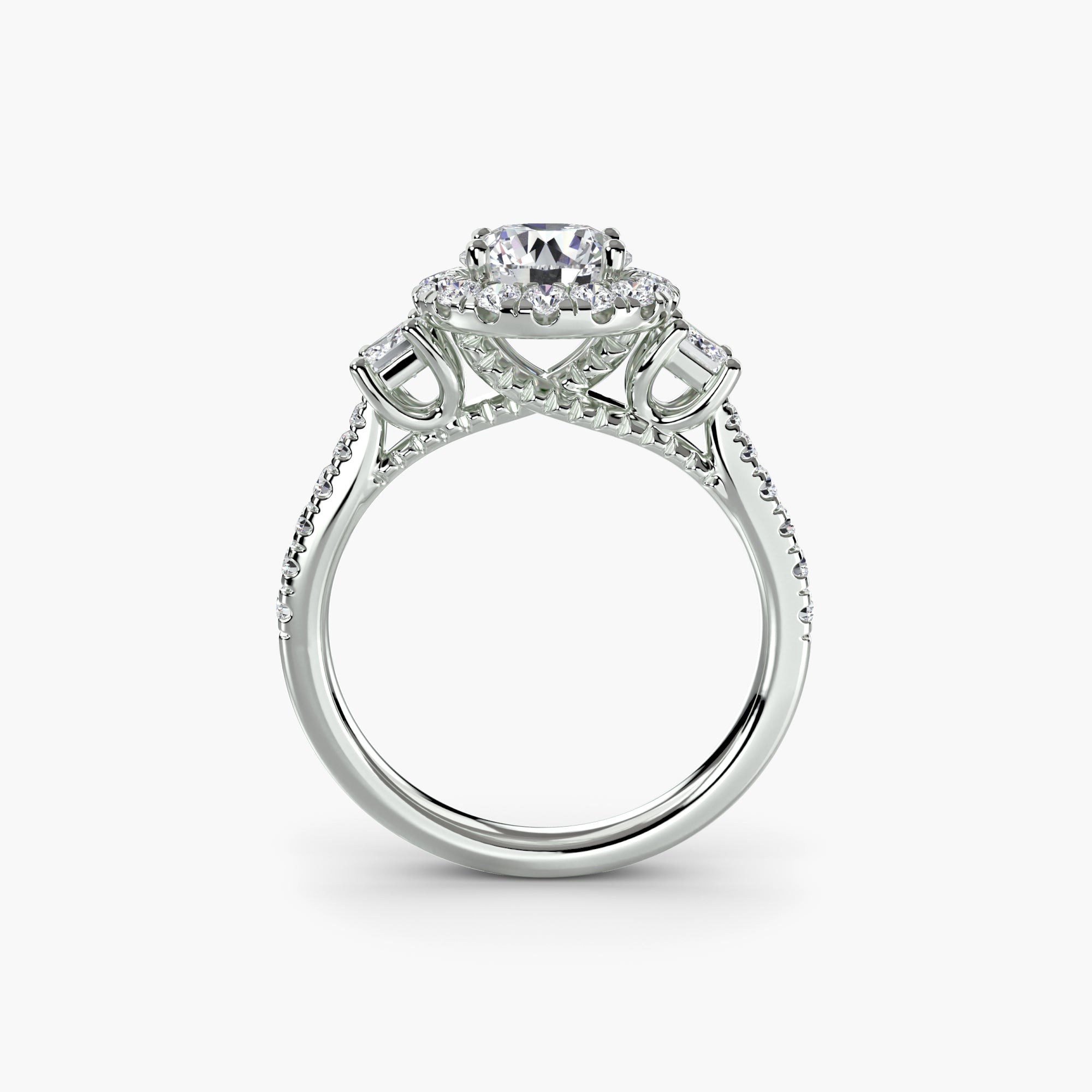 The MICHAEL ISAAC Three-Stone Ring with Halo 2 features a round center diamond, a sparkling diamond halo, and extra diamonds on the band and beneath the setting in elegant white gold.