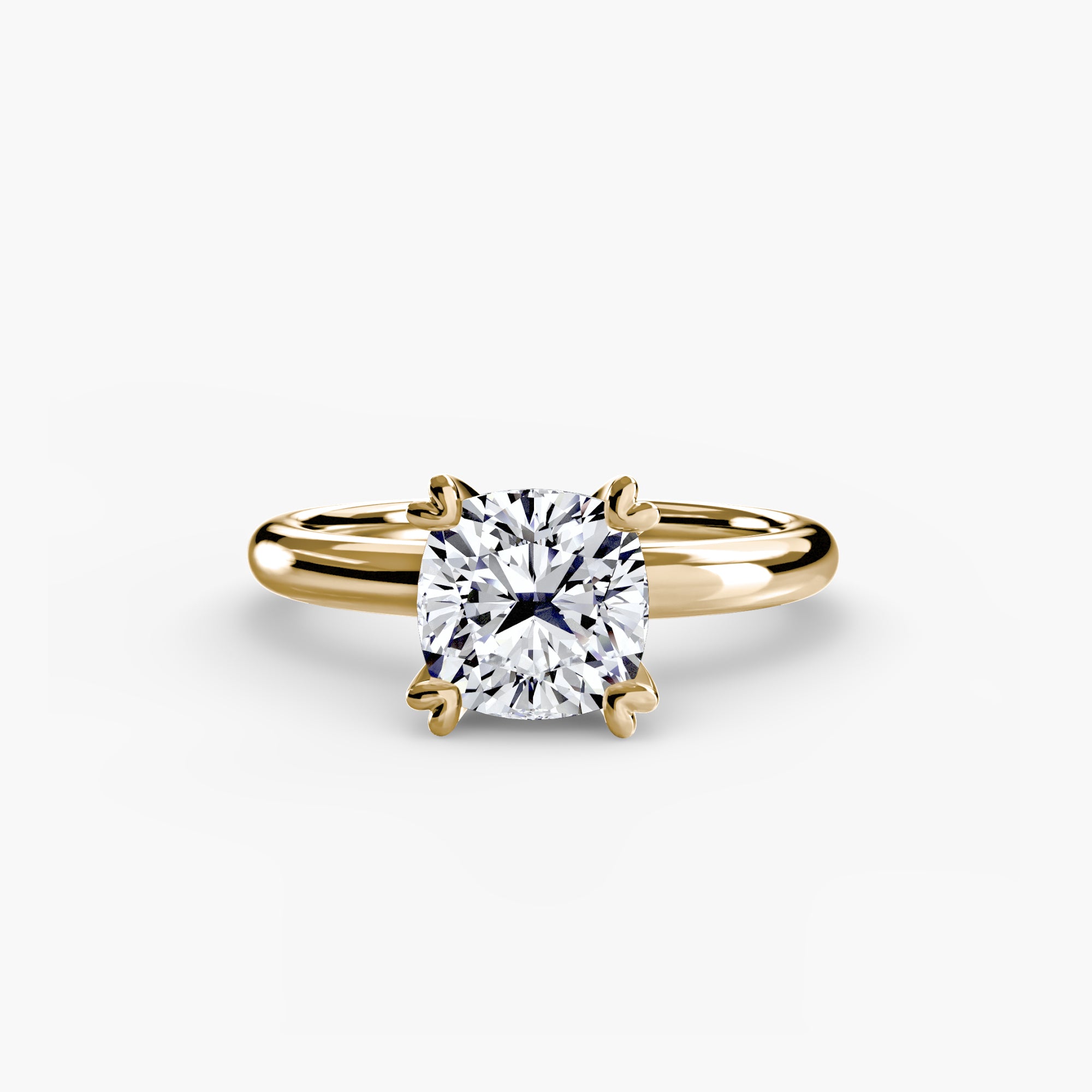 The MICHAEL ISAAC Solitaire ring 2 features a cushion-cut diamond in a classic four-prong gold setting, shown on a plain white background—ideal for those who love timeless, minimalist styles.
