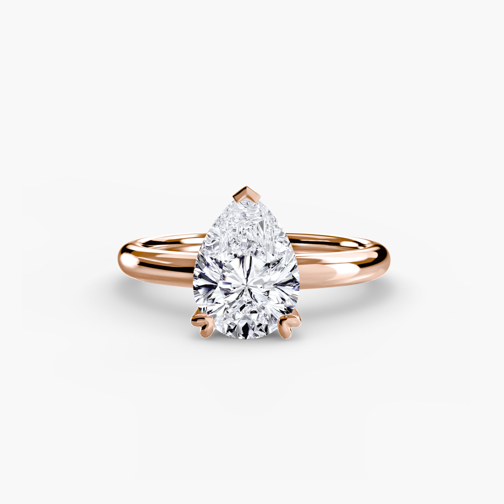 The MICHAEL ISAAC Solitaire ring 2 is a rose gold minimalist ring with a large pear-shaped diamond solitaire in a classic prong setting, shown against a plain white background.