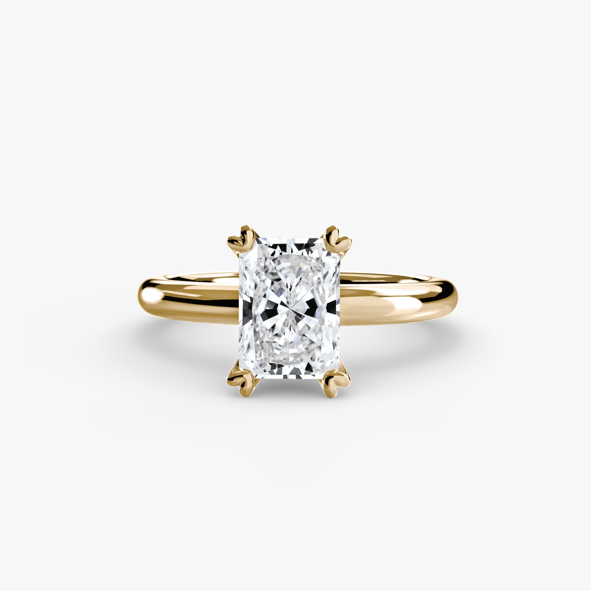 The MICHAEL ISAAC Solitaire ring 2 features a radiant-cut rectangular diamond solitaire set in four prongs on a sleek gold band, shown against a white background.