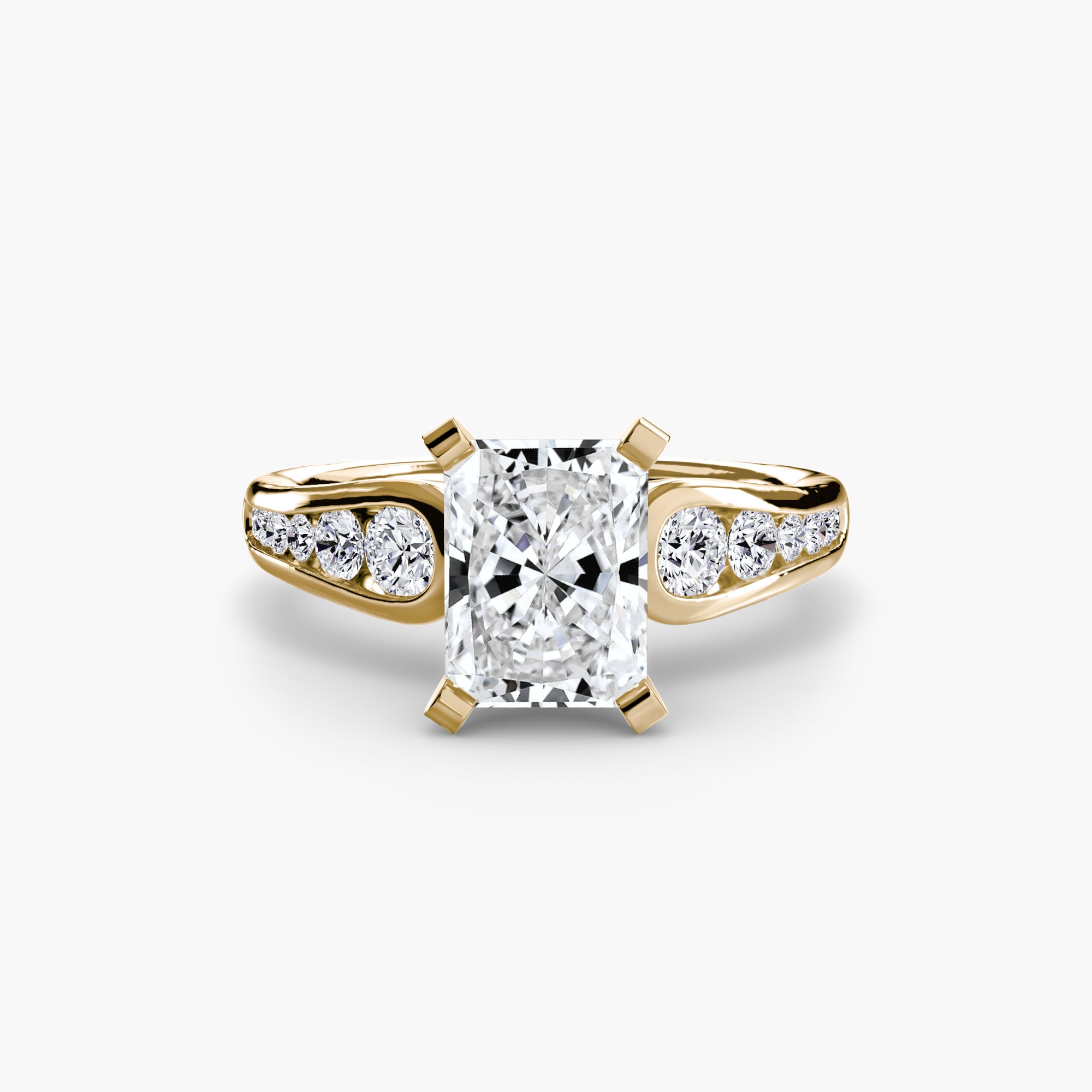 The Solitaire with Pavé 2 by MICHAEL ISAAC features a radiant-cut diamond center in gold, accented by pavé-set round diamonds along the band—a perfect choice for those who love everyday luxury.