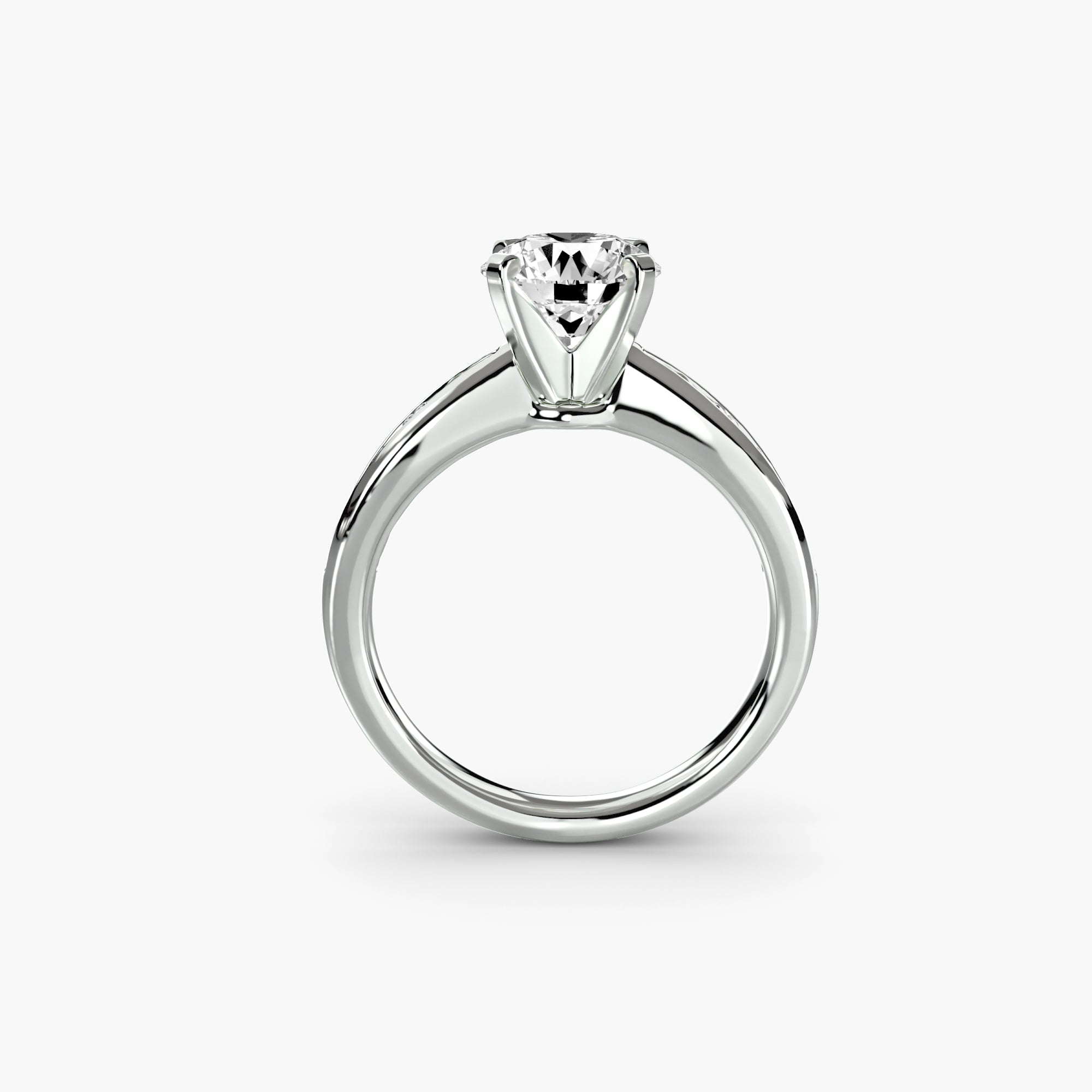 The MICHAEL ISAAC Solitaire with Pavé 3 showcases a round, brilliant-cut diamond in a six-prong white metal band, viewed from the side on a white background—an ideal choice for lovers of subtle everyday elegance.