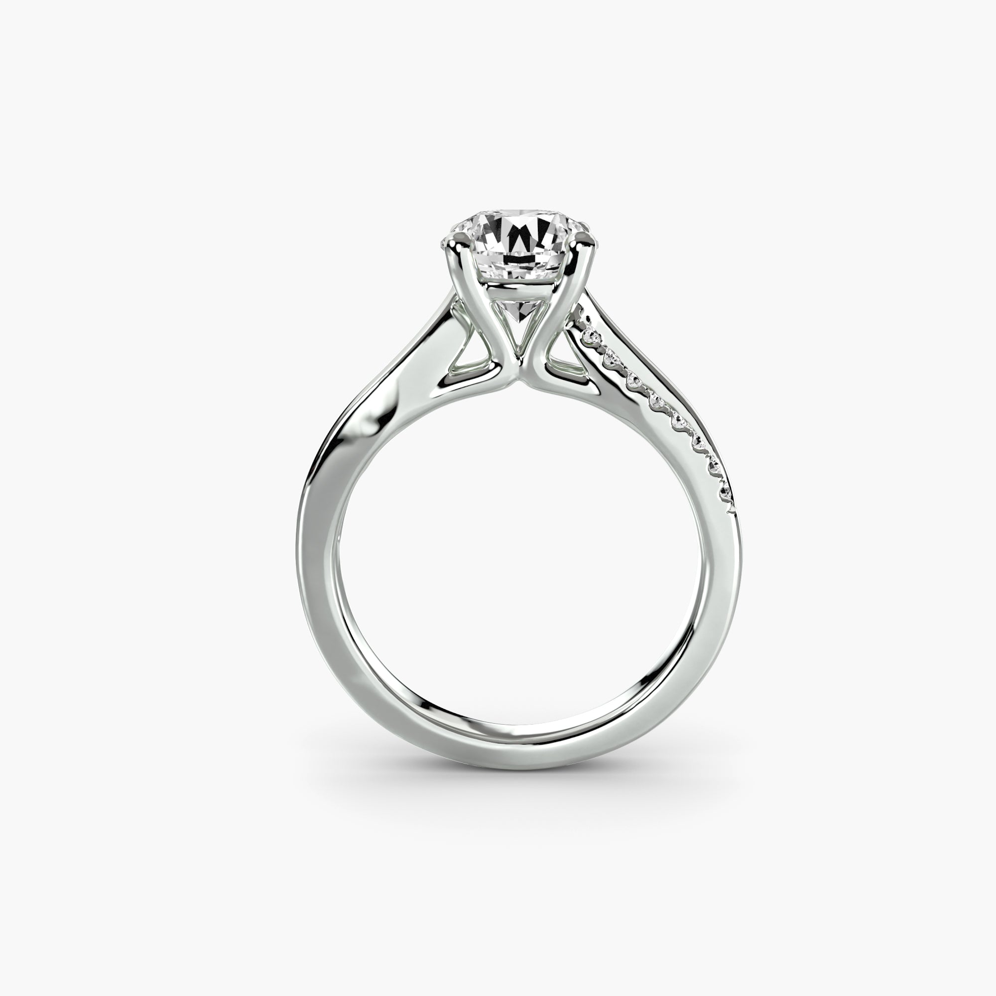 The Split Shank Pavé Solitaire by MICHAEL ISAAC is a silver ring featuring a round diamond in a prong setting, with pavé-set accent diamonds on the band, showcasing everyday luxury against a plain white background.