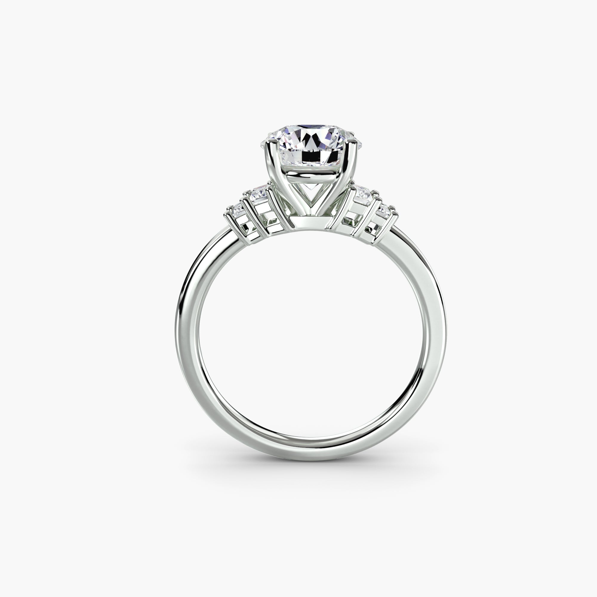 The MICHAEL ISAAC Baguette Accent Solitaire features a round diamond in a platinum setting, with baguette accent diamonds on the band, displayed on a white background—ideal for fans of minimalist ring styles.