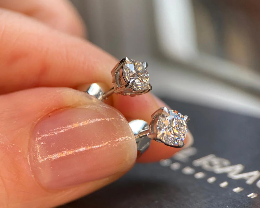 Close-up of classic diamond stud earrings available in York