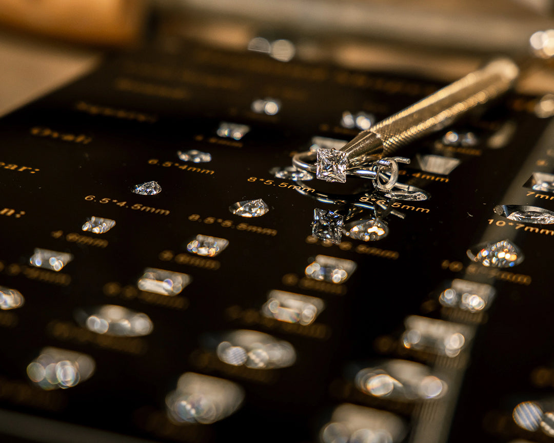 Comparison of round, oval, and princess diamond cuts in York showroom