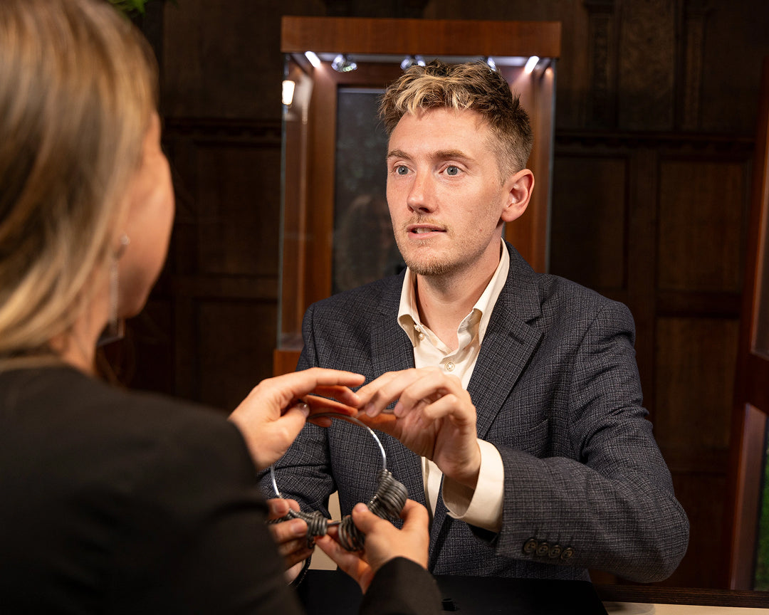 Couple discussing engagement ring budget at York showroom