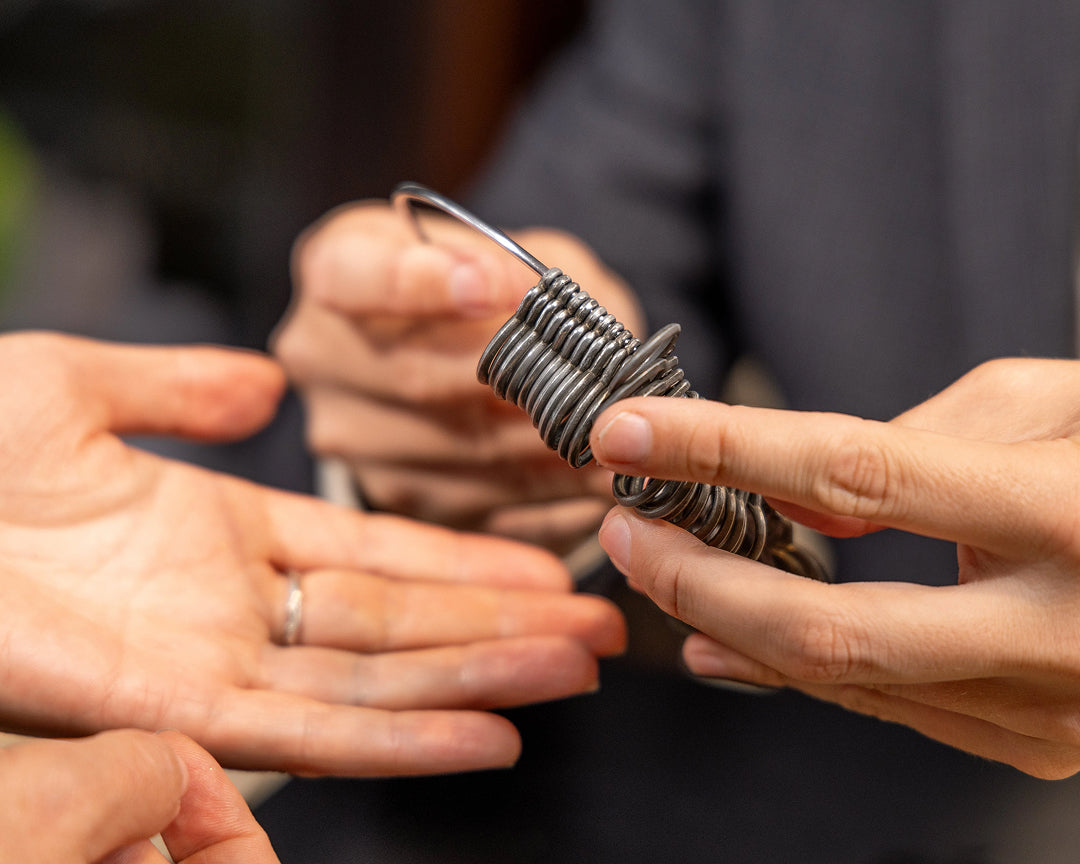 Groom selecting wedding band at York jewellery studio