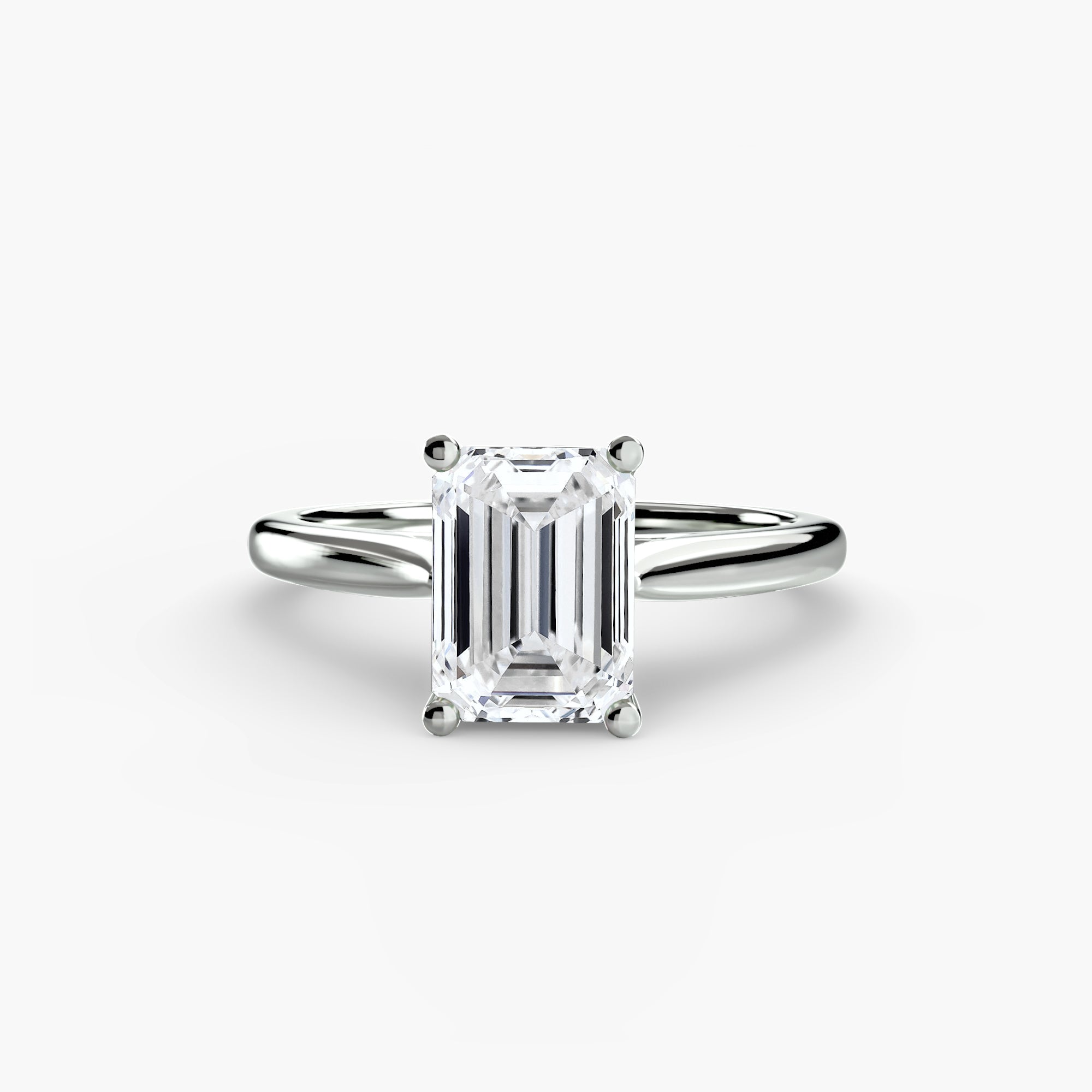 The MICHAEL ISAAC Solitaire ring 1 is a white gold ring with a rectangular emerald-cut diamond in a four-prong classic setting, shown on a white background.