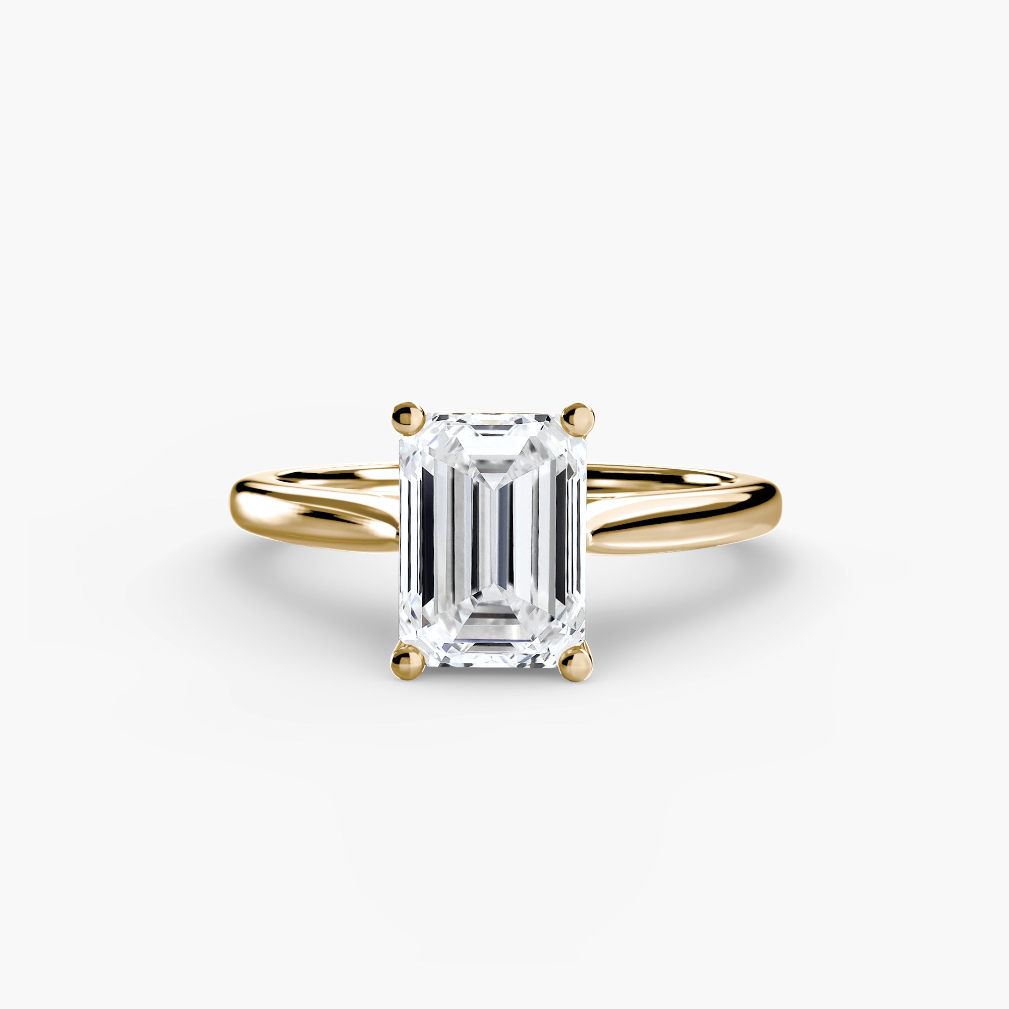 The MICHAEL ISAAC Solitaire ring 1 is a gold minimalist ring with an emerald-cut diamond in a classic four-prong setting, shown on a plain white background.