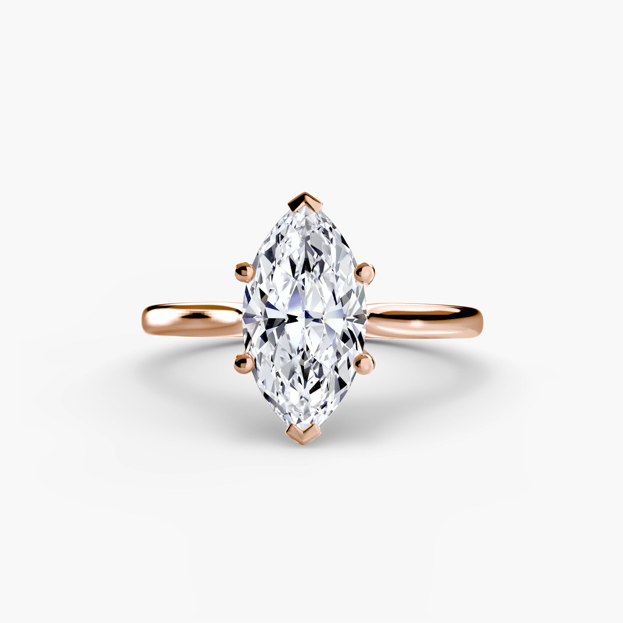 The MICHAEL ISAAC Solitaire ring 1 features a marquise-cut diamond in a classic setting with a rose gold band, displayed on a white background.