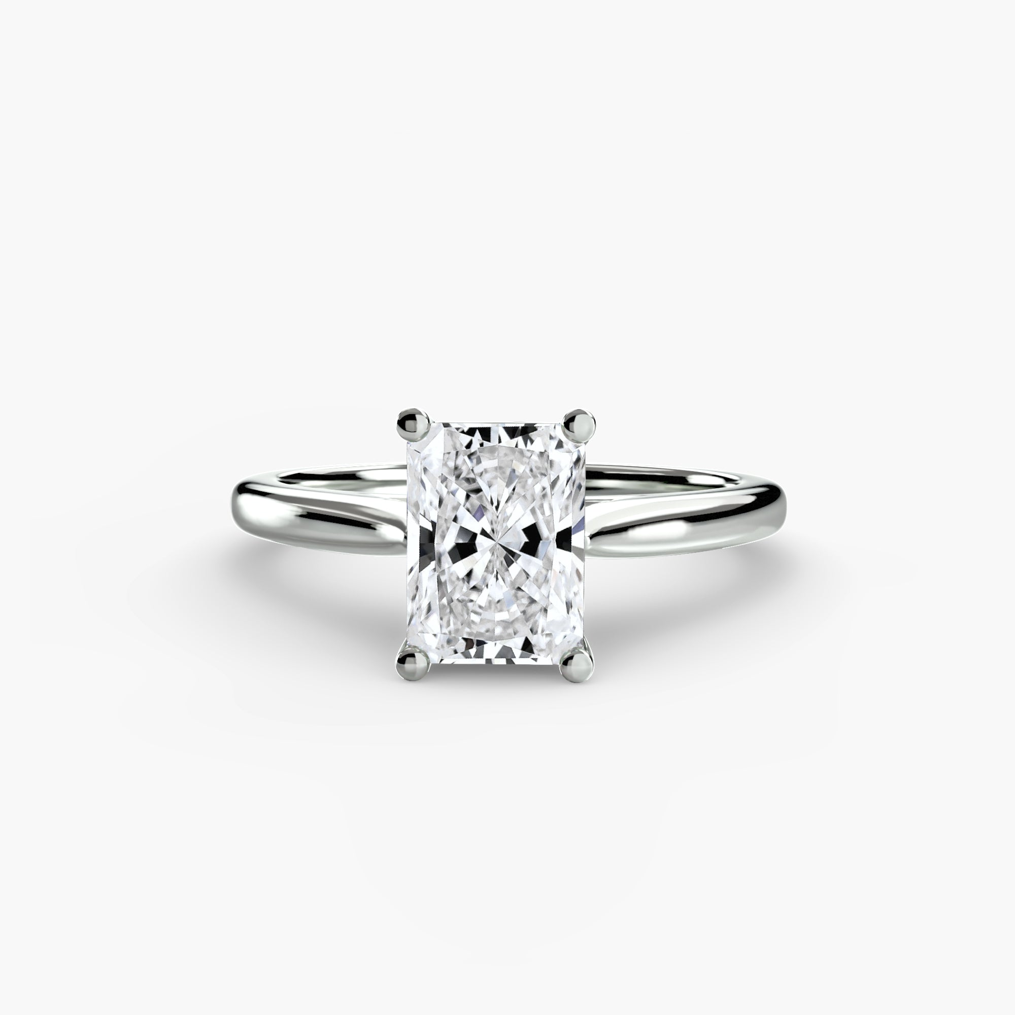 The MICHAEL ISAAC Solitaire ring 1 features a rectangular radiant-cut diamond in a classic four-prong white gold or platinum setting, shown against a plain white background.