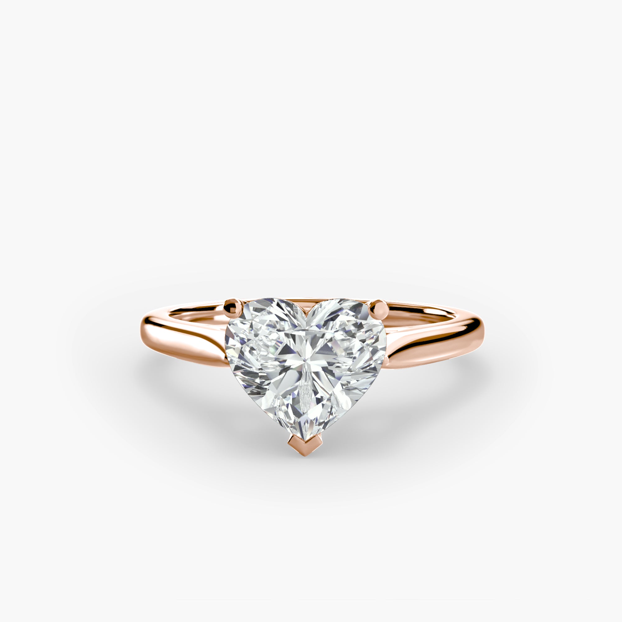 The MICHAEL ISAAC Solitaire ring 1 features a large heart-shaped diamond in a rose gold classic setting, displayed on an elegant band against a plain white background.
