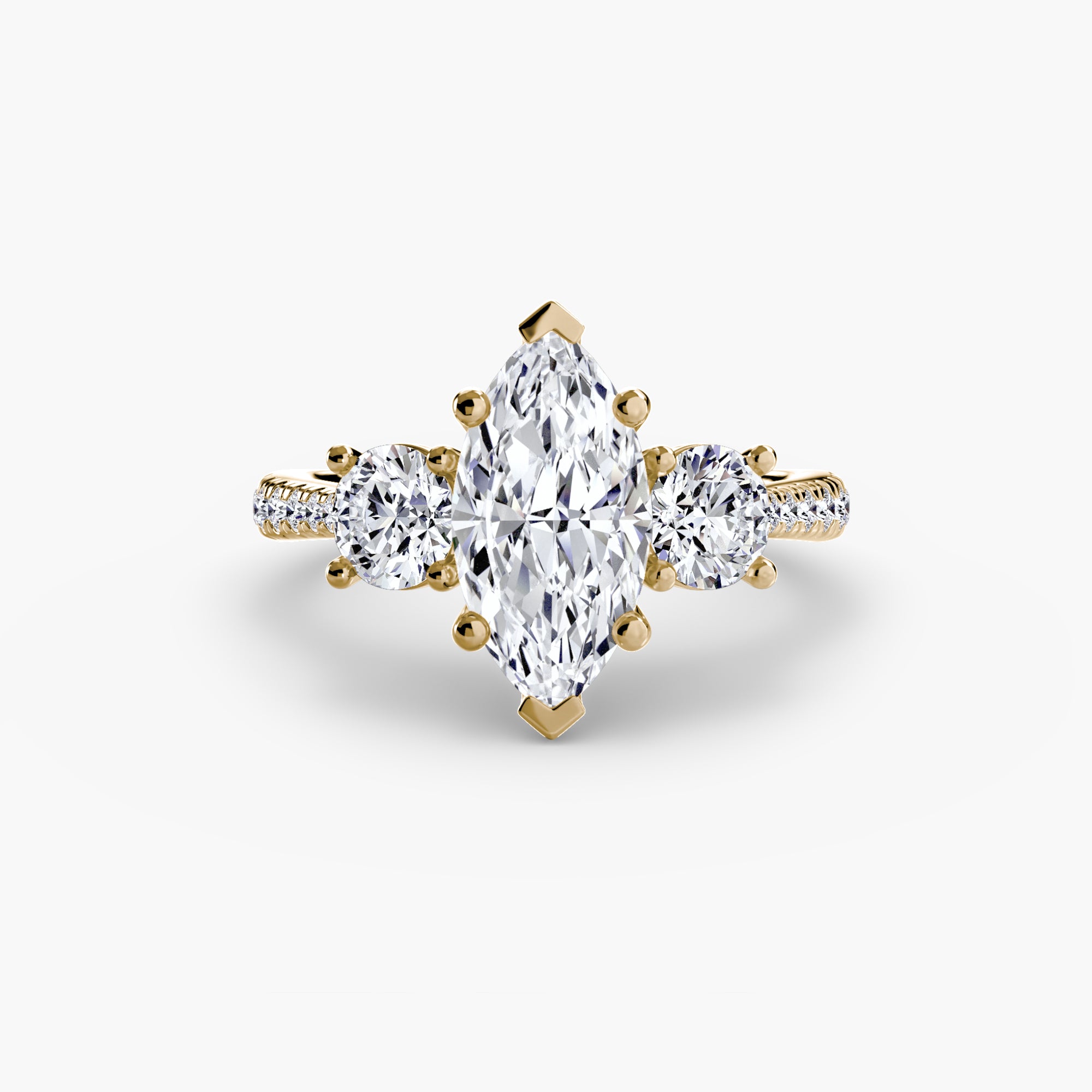 The MICHAEL ISAAC Three-Stone with Pavé Band ring showcases a marquise-cut center diamond, two round side diamonds, and pavé-set accent stones for a refined, symmetrical look.