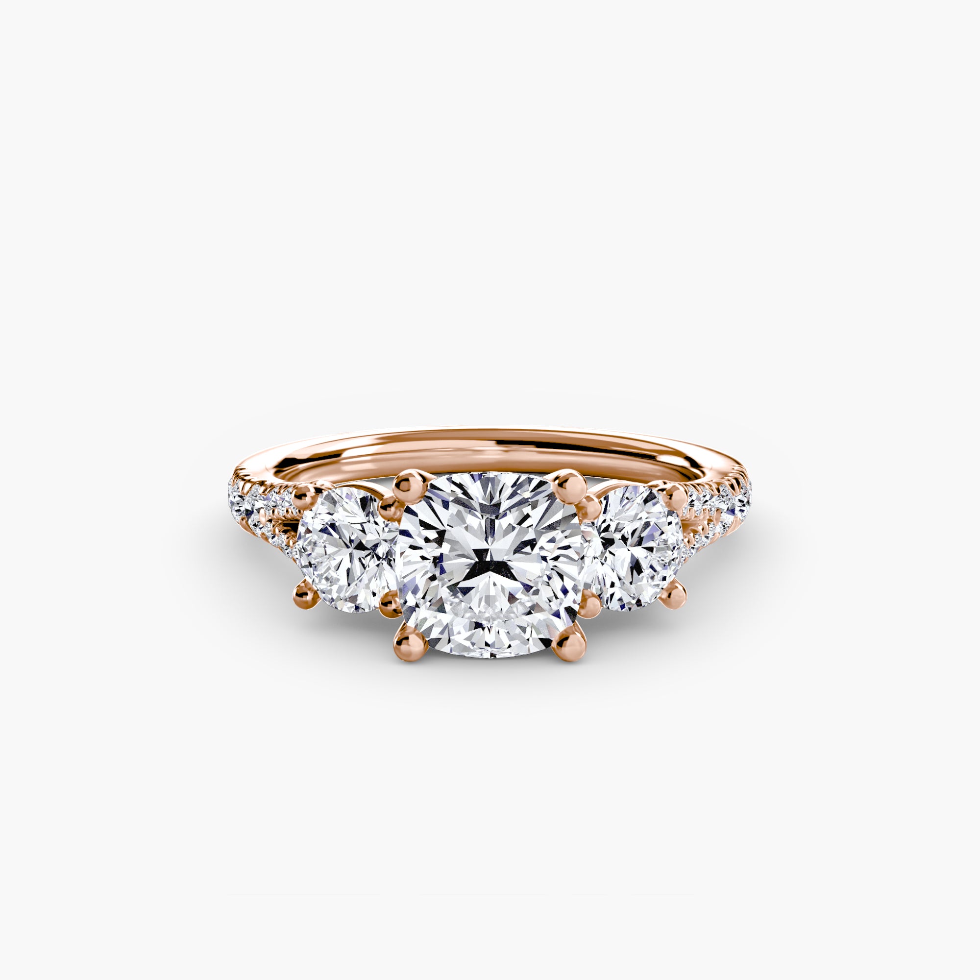The MICHAEL ISAAC Three-Stone with Pavé Band 3 is a rose gold ring with a large round center diamond, two side diamonds, and pavé-set accents along the elegant band.