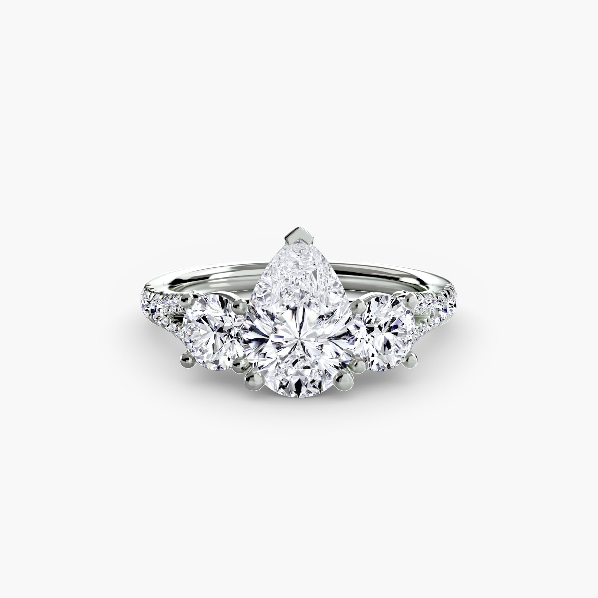 The MICHAEL ISAAC Three-Stone with Pavé Band 3 is a platinum ring showcasing a prominent pear-shaped diamond center, two round side diamonds, and sparkling pavé-set diamonds along its elegant band.