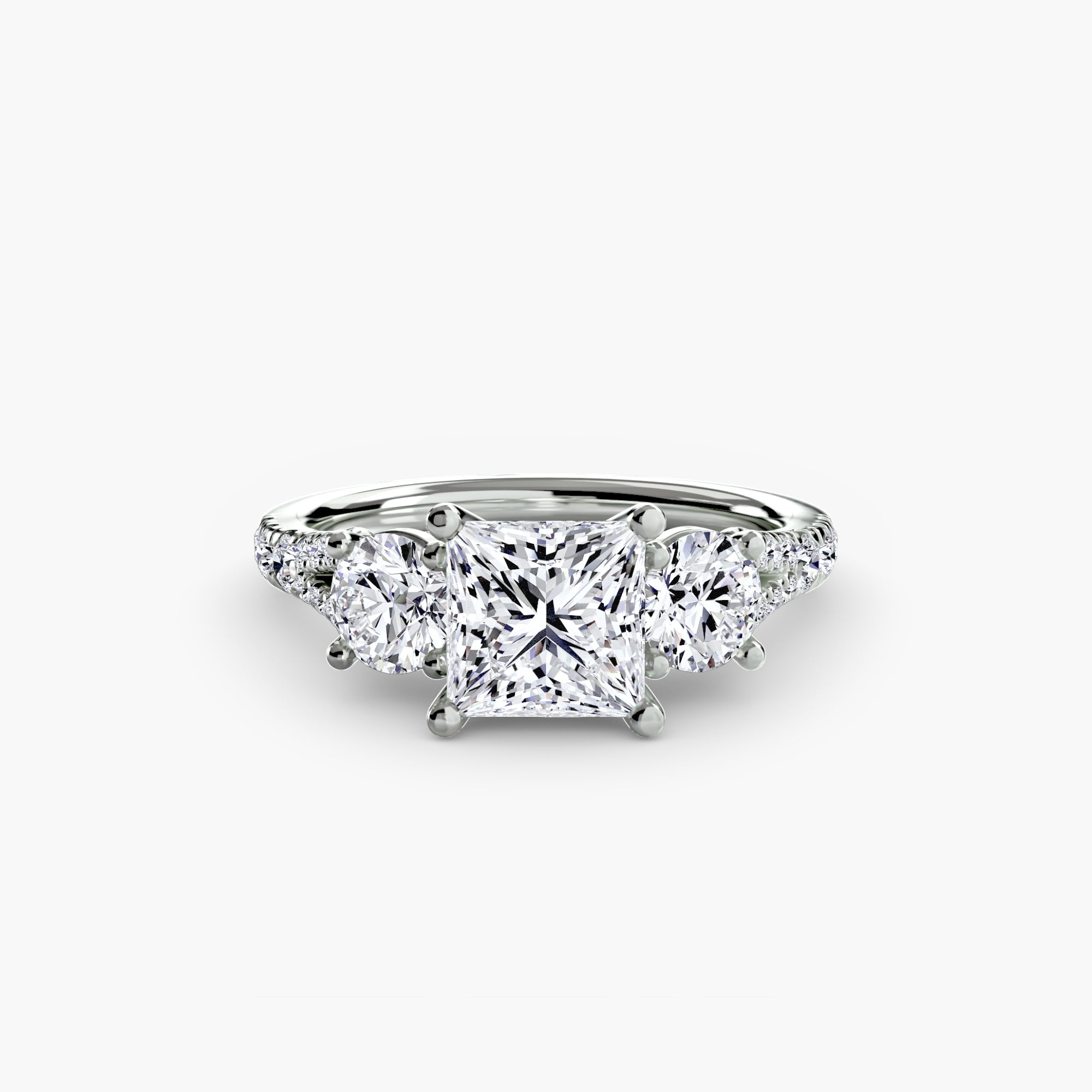 The MICHAEL ISAAC Three-Stone with Pavé Band 3 is a platinum ring featuring a square-cut center diamond, two round side diamonds, and pavé accents, all shown on a plain white background.