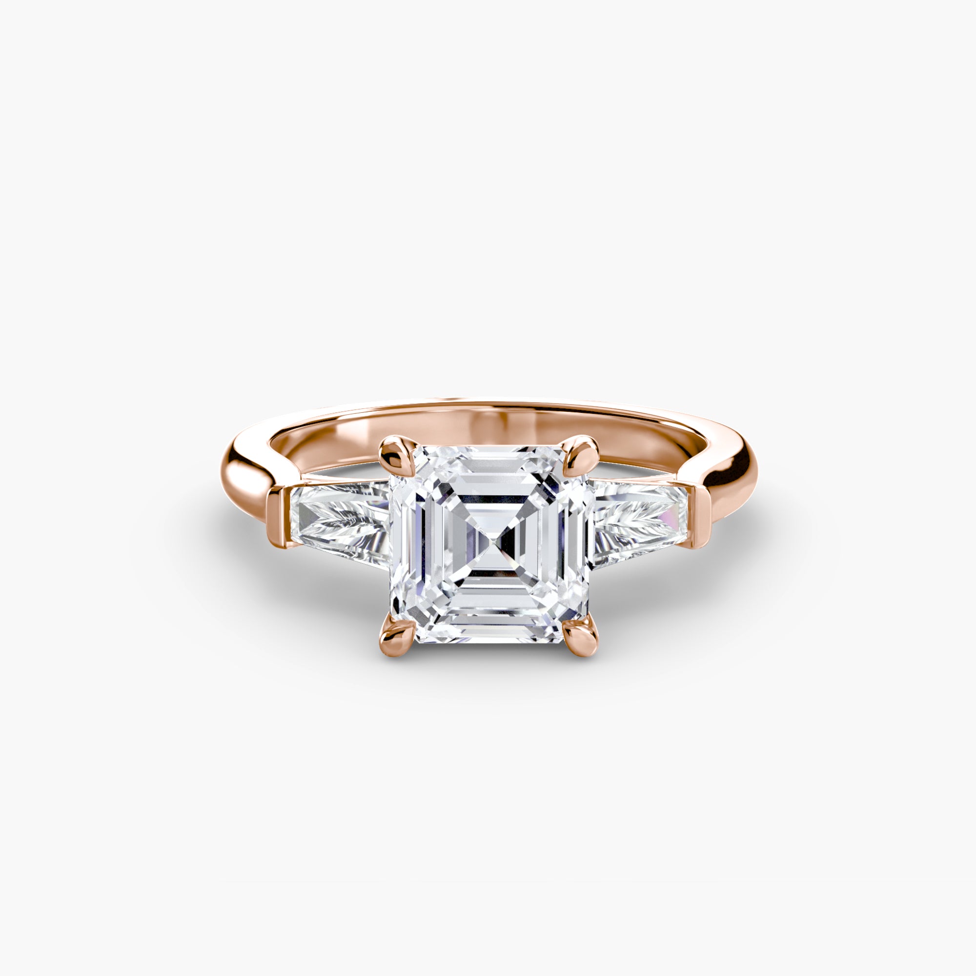 The MICHAEL ISAAC Three-Stone Ring features a large square-cut diamond and two baguette side stones, elegantly displayed on a white background.