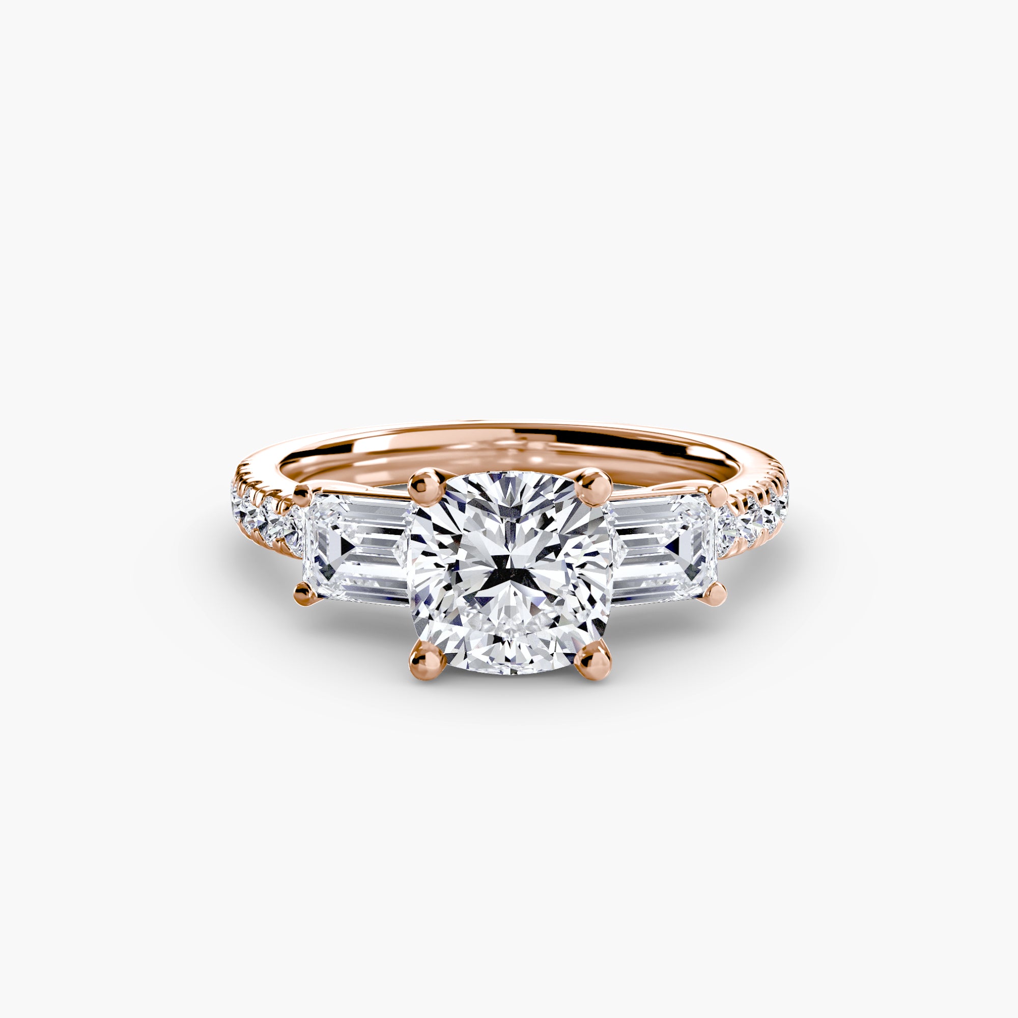 The MICHAEL ISAAC Three-Stone Ring with Pavé Band 4 showcases a rose gold setting with a round center diamond, two baguette side stones, and a pavé band of sparkling smaller diamonds for timeless elegance.