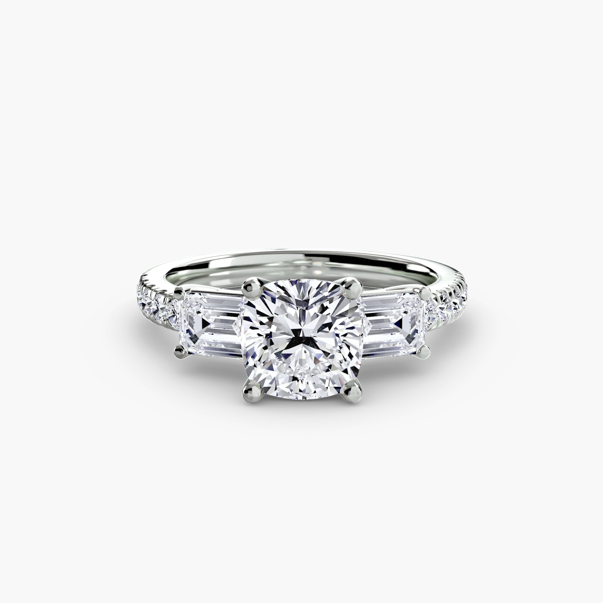 The MICHAEL ISAAC Three-Stone Ring with Pavé Band 4, showcasing a cushion-cut center diamond, two rectangular side diamonds, and pavé accents, is displayed on a white background.