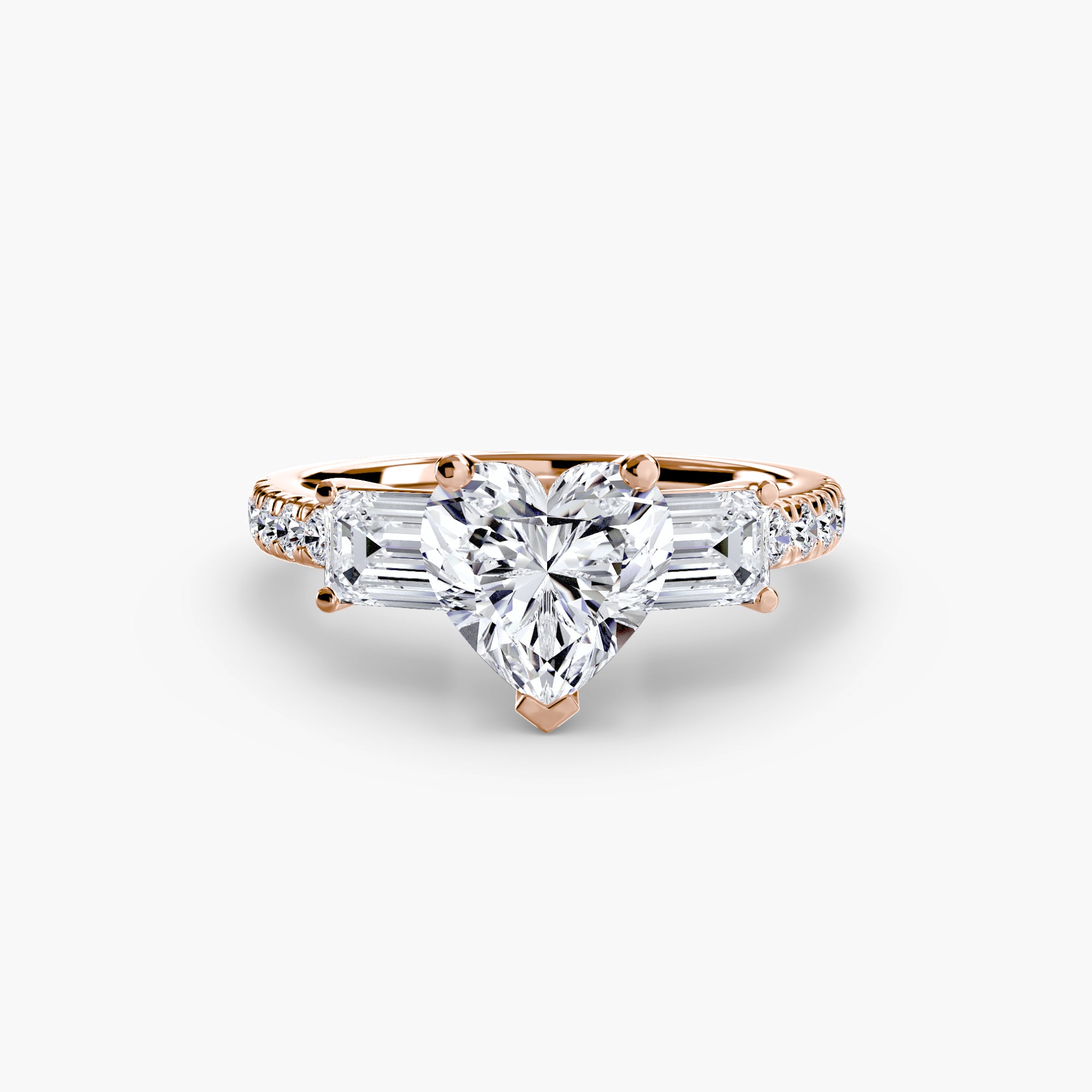The MICHAEL ISAAC Three-Stone Ring with Pavé Band 4 features an elegant heart-shaped diamond center, trapezoid-cut side stones, and a rose gold pavé band with small round diamonds.