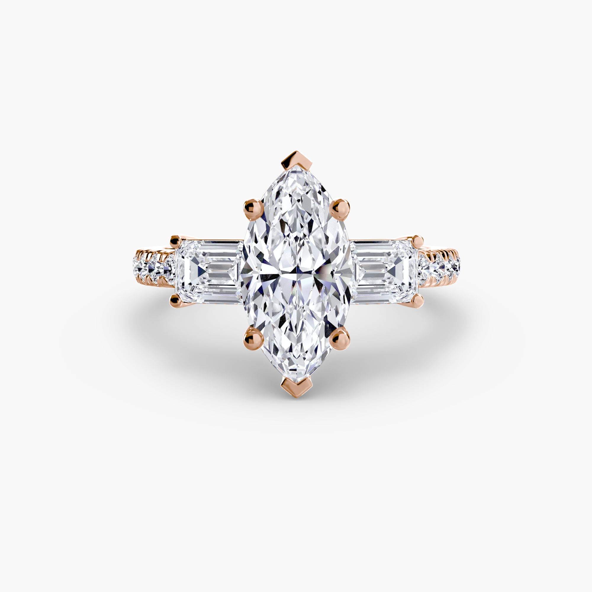 The MICHAEL ISAAC Three-Stone Ring with Pavé Band 4 features an elegant marquise-cut diamond and baguette side stones set in rose gold, shown on a white background.