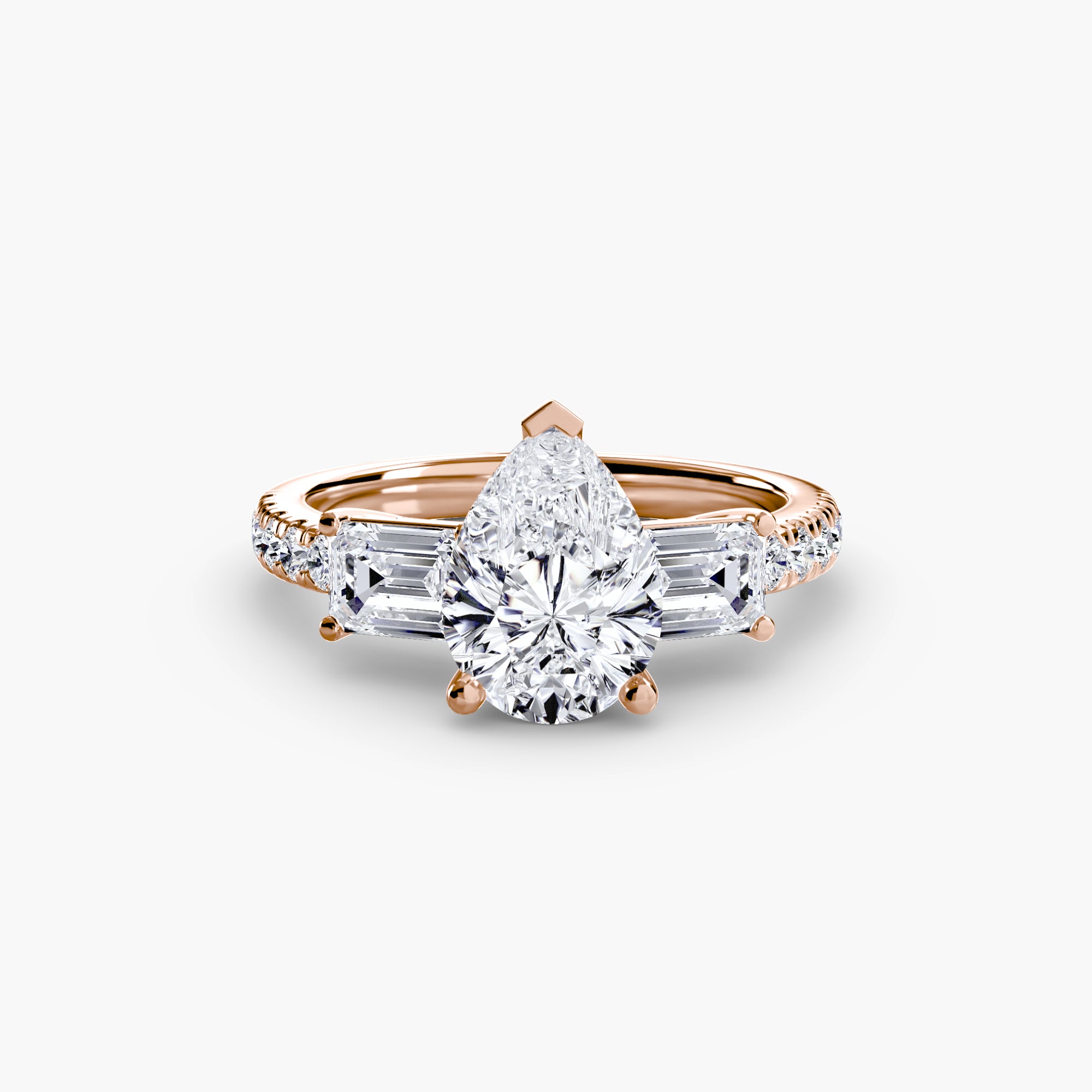 The MICHAEL ISAAC Three-Stone Ring with Pavé Band 4 showcases a large pear-shaped diamond, two trapezoid-cut side diamonds, and pavé-set round diamonds on a rose gold band, displayed on a plain white background.