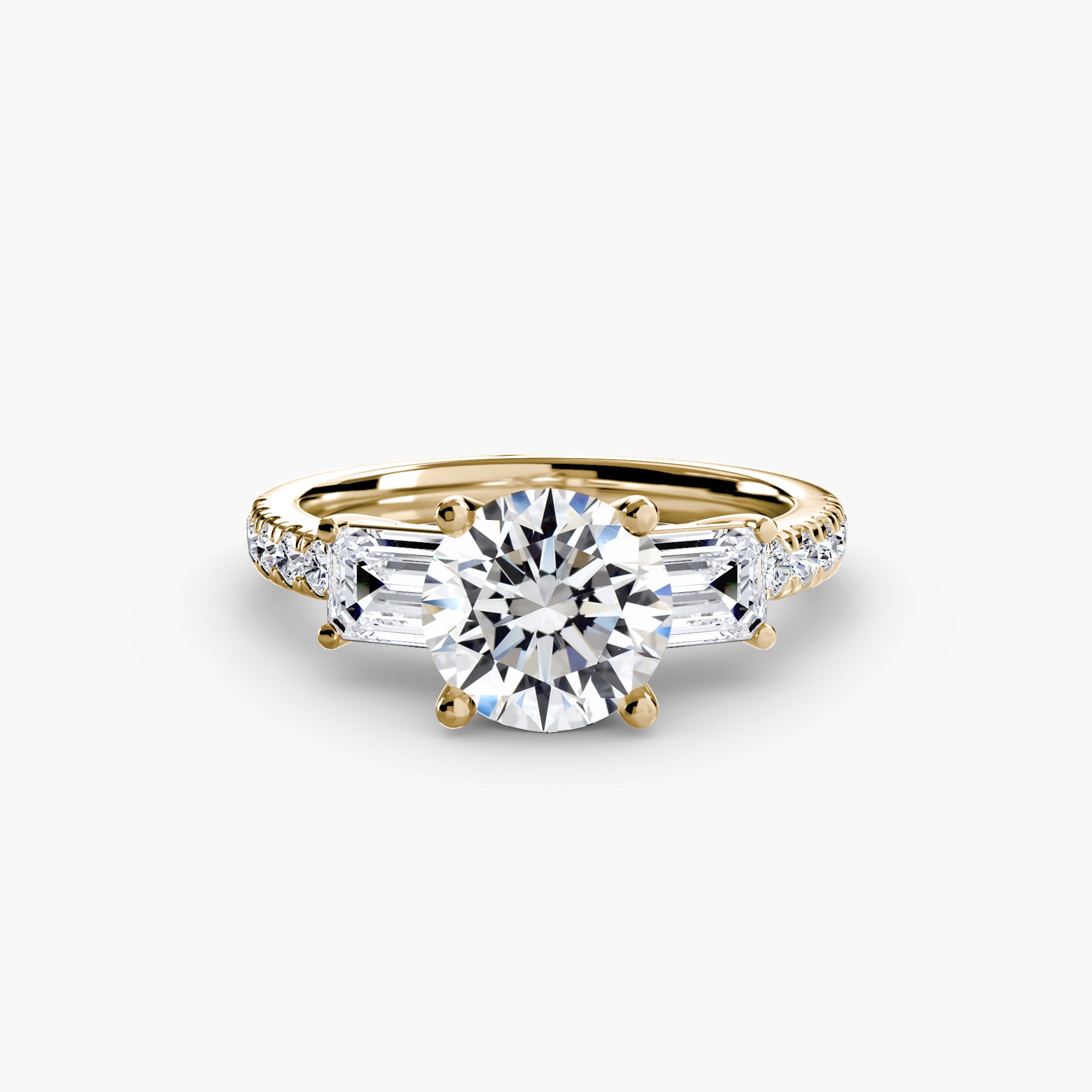 The MICHAEL ISAAC Three-Stone Ring with Pavé Band 4 features a large round center diamond, two baguette-cut side diamonds, and pavé accents for added brilliance in an elegant gold design.