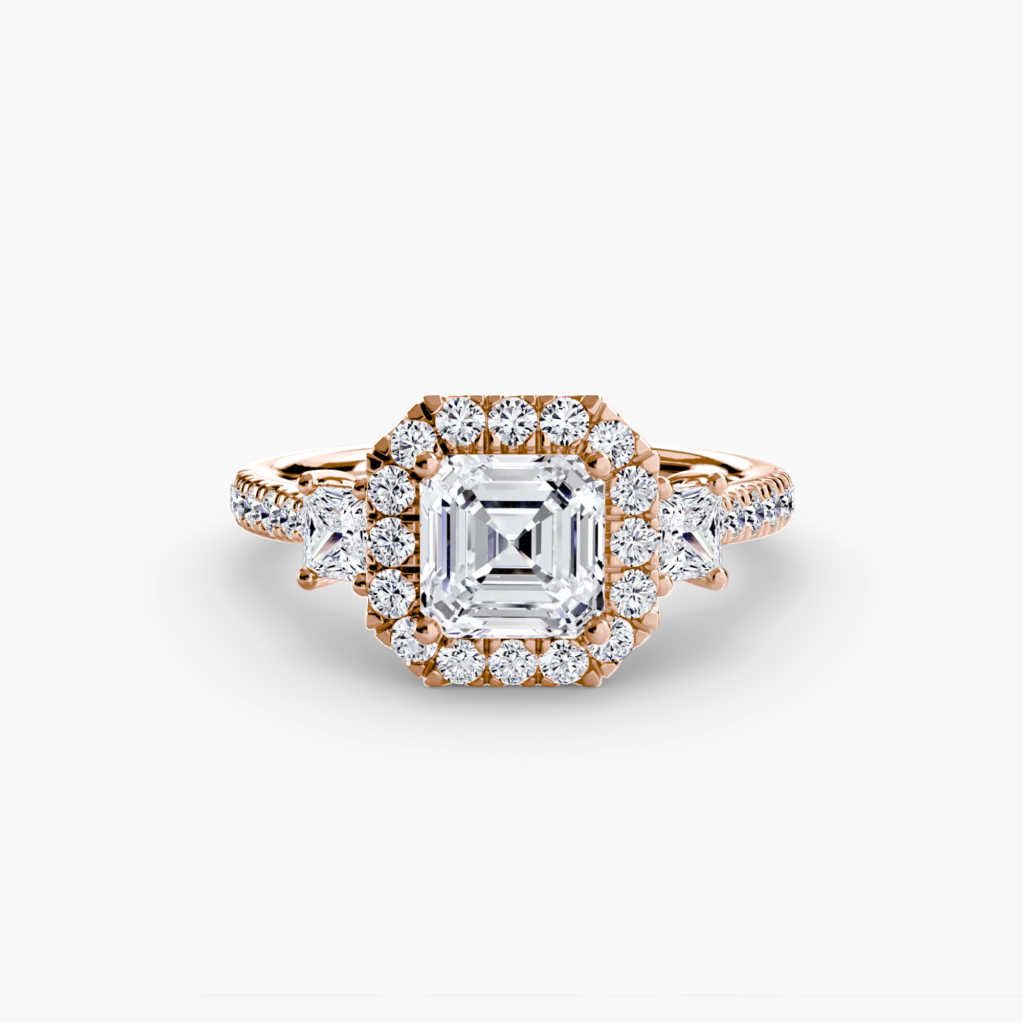 The MICHAEL ISAAC Three-Stone Ring with Halo 2 in rose gold showcases a large square-cut center diamond, a radiant round diamond halo, and additional diamonds along its elegant band.