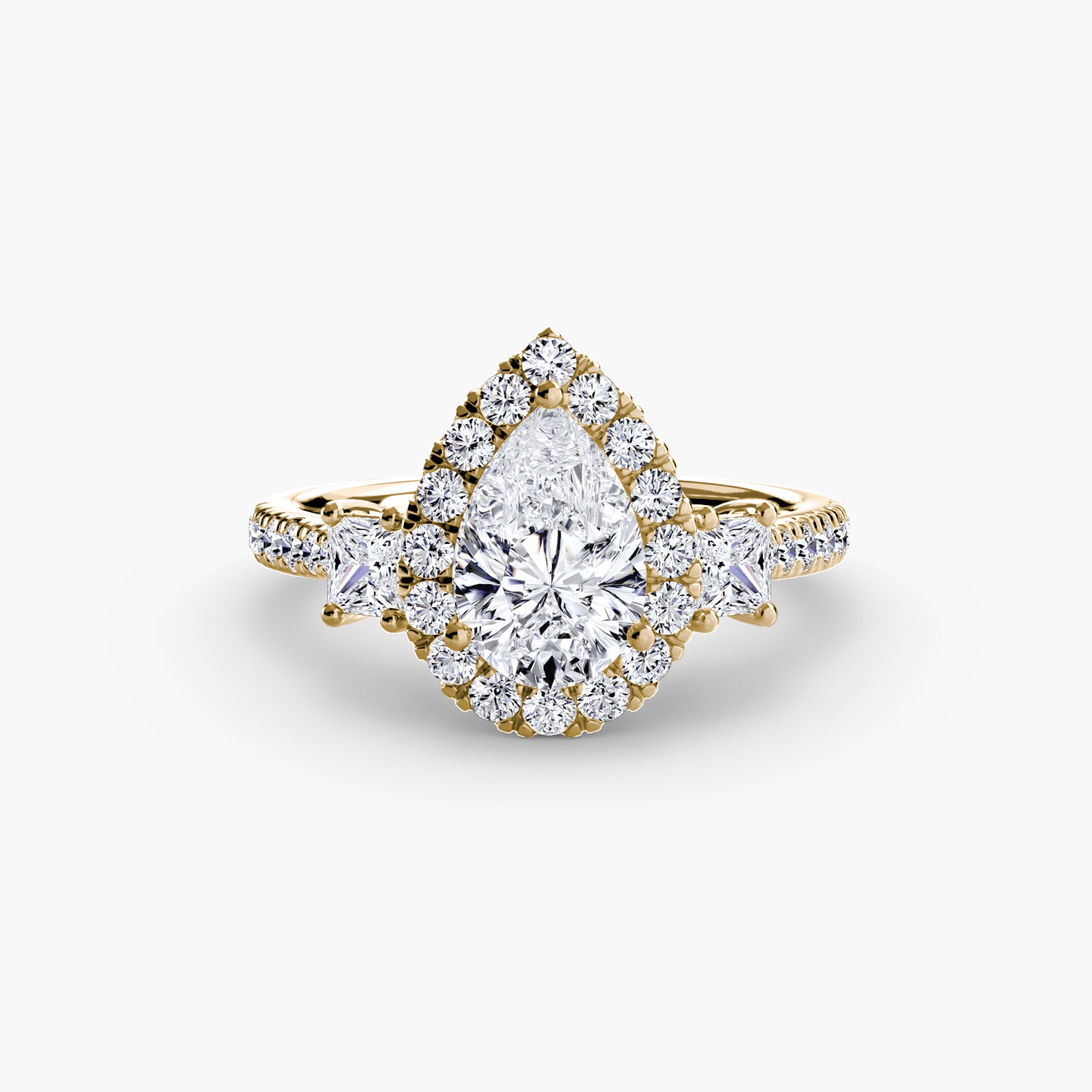 The MICHAEL ISAAC Three-Stone Ring with Halo 2 features a gold band with a large pear-shaped diamond, radiant halo of round diamonds, and additional diamonds along the band, displayed on a plain white background.