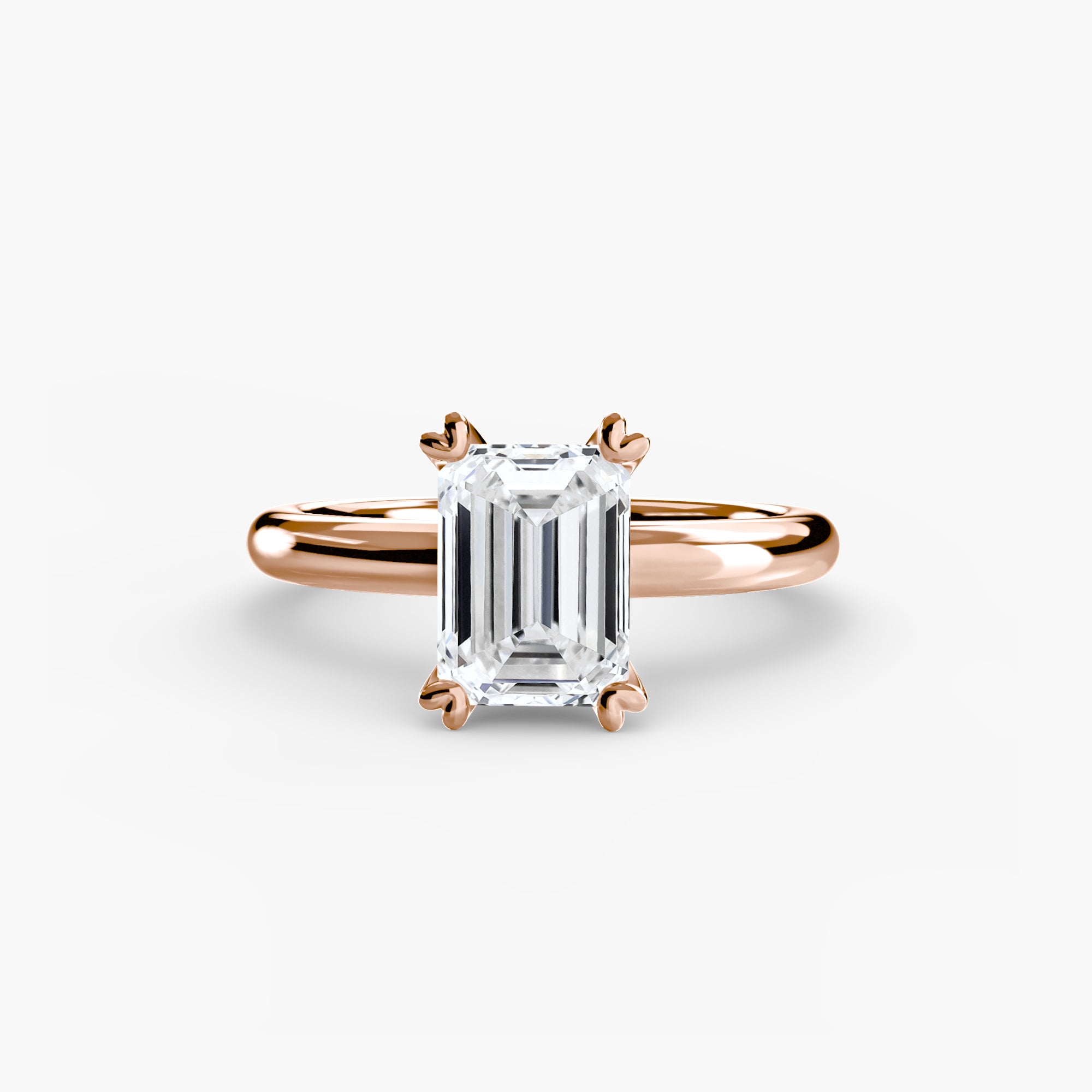 The MICHAEL ISAAC Solitaire ring 2 features a rose gold band with a rectangular emerald-cut diamond in a classic four-prong setting, displayed against a plain white background.