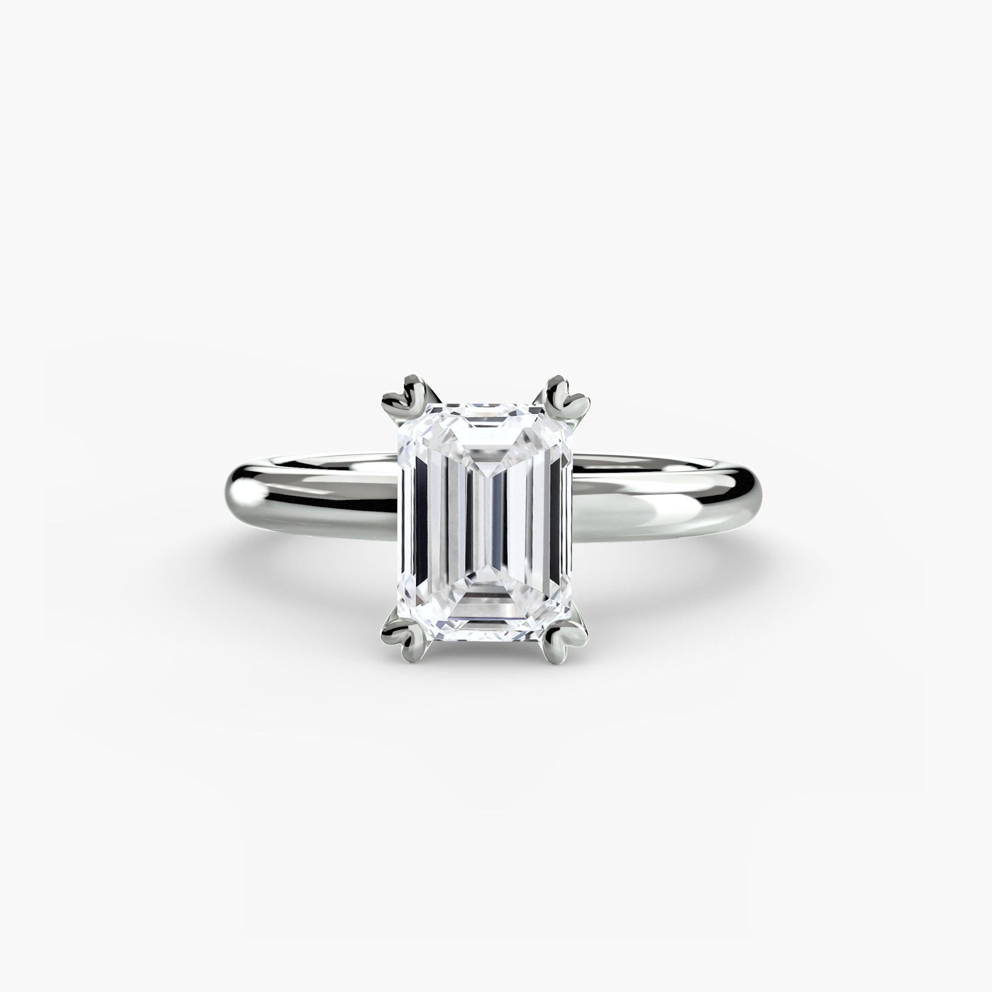The MICHAEL ISAAC Solitaire ring 2 is a white gold ring with a rectangular emerald-cut diamond in a four-prong classic setting, shown on a plain light background.