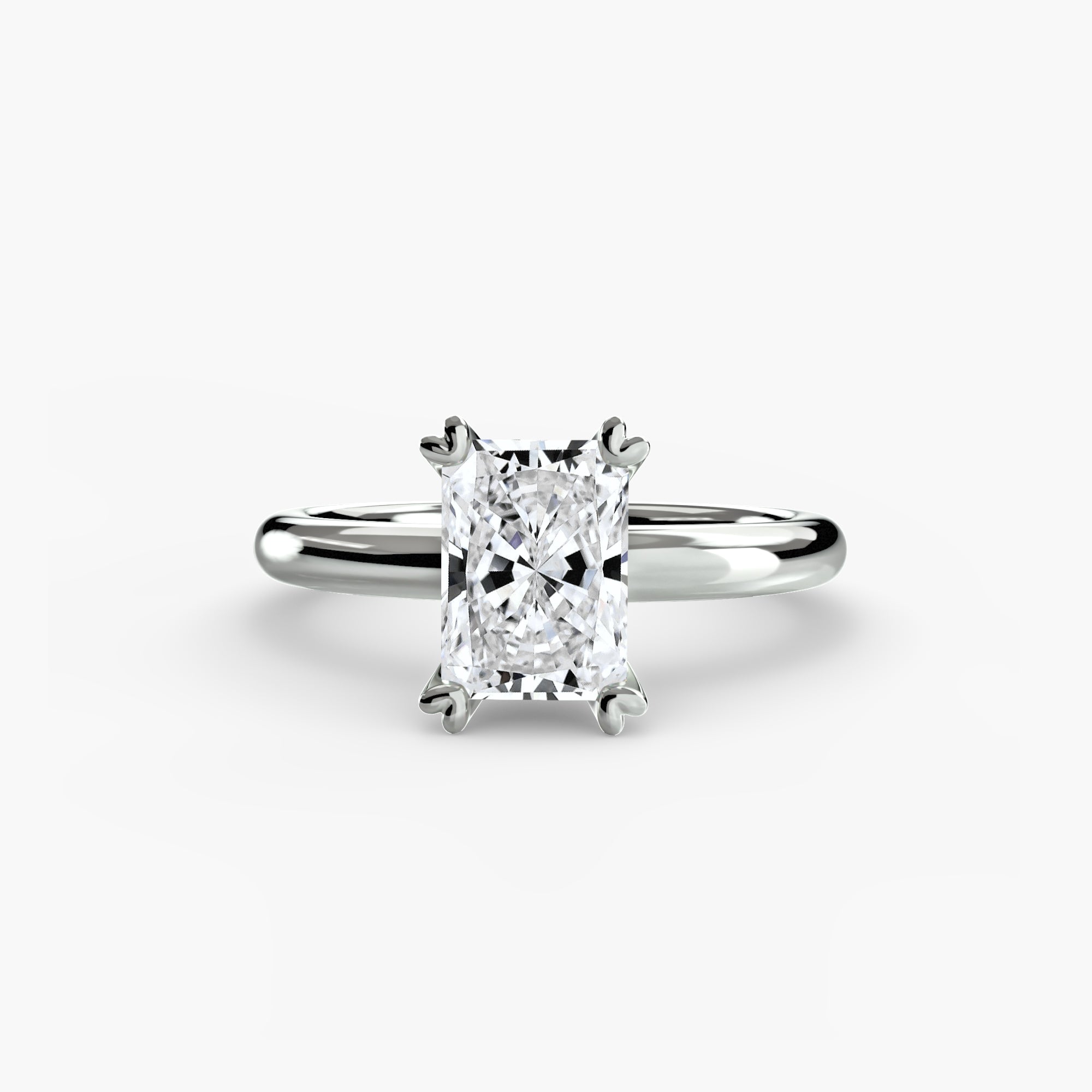 The MICHAEL ISAAC Solitaire ring 2 is a silver ring featuring a radiant-cut diamond in a classic four-prong setting, displayed on a plain white background.