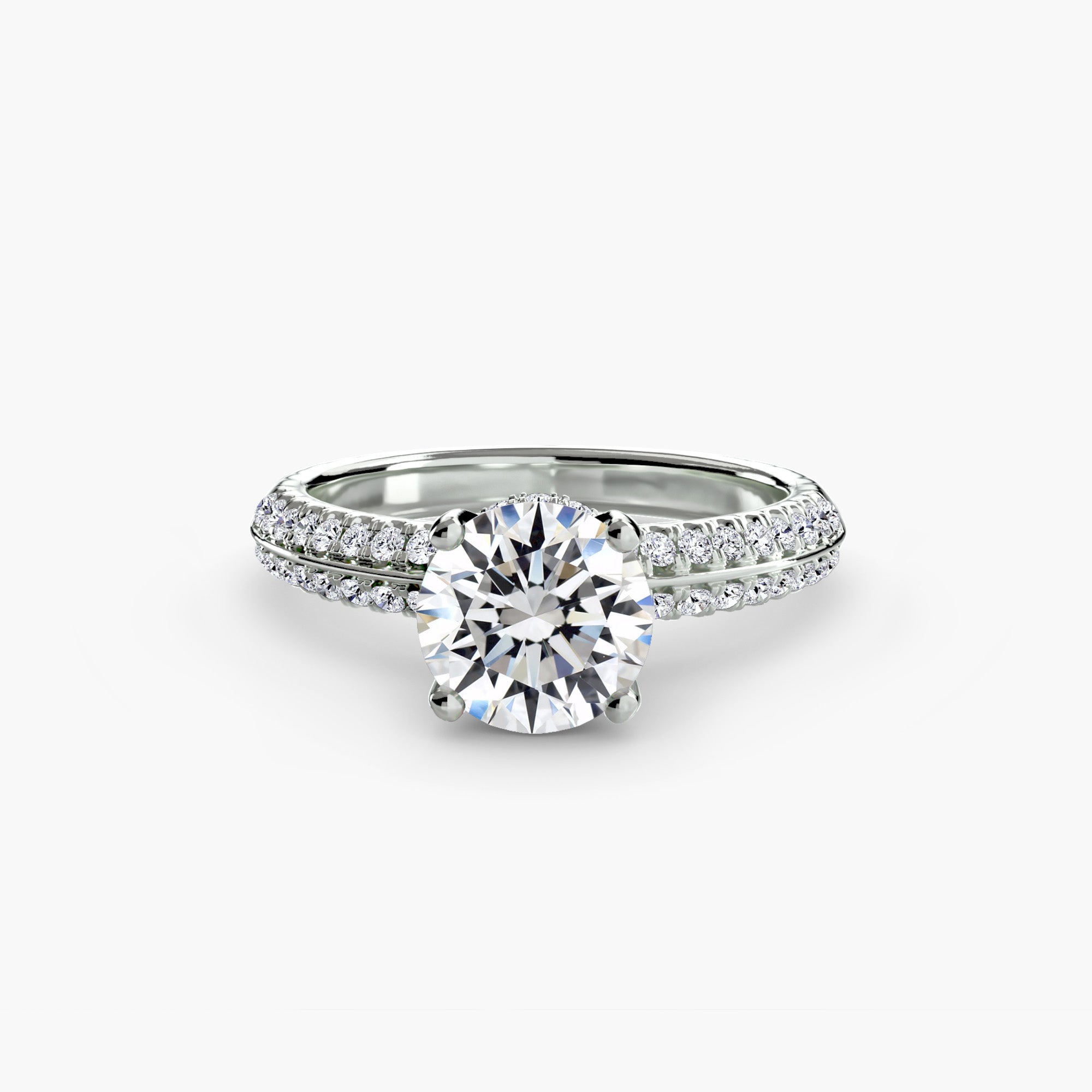 The MICHAEL ISAAC Solitaire with Pavé is a silver ring with a large round-cut diamond center and an elegant pavé-set band, showcasing everyday luxury against a white background.